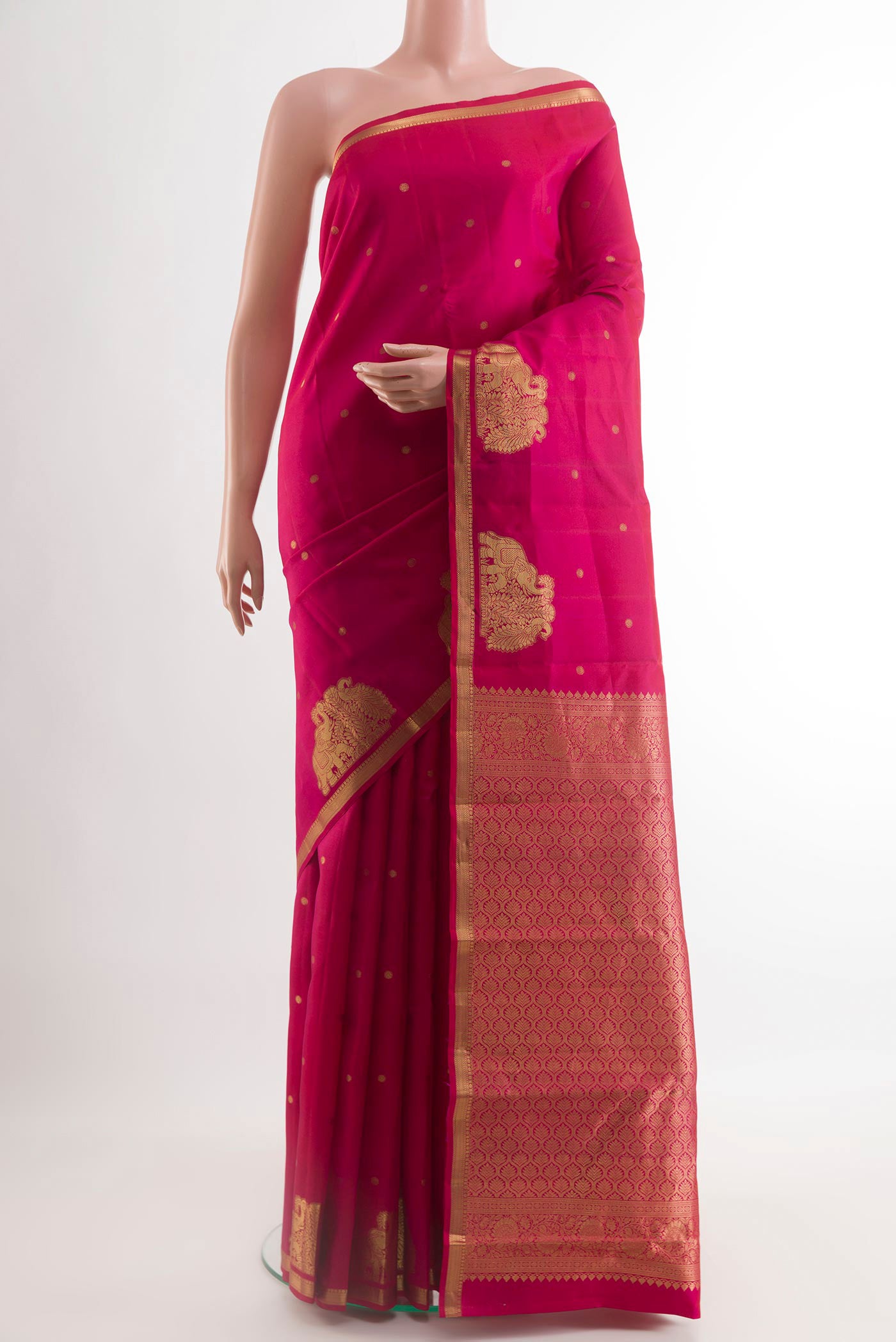 Pink Kanchipuram Silk Saree with Zari Butta on the body and Zari Border.  displayed on a mannequin
