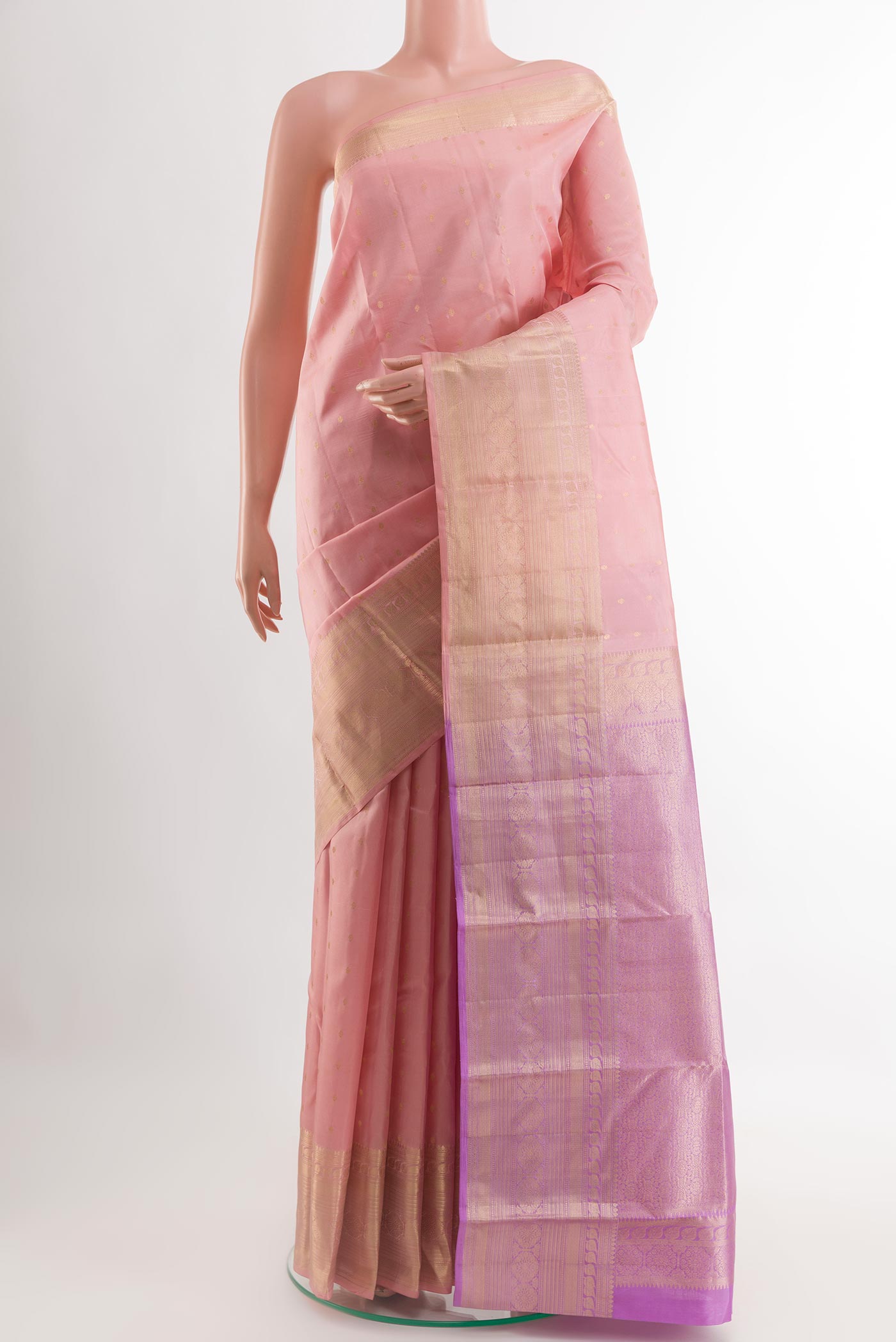 Rose pink Kanchipuram Silk Saree with Zari Butta on the body and Zari Border.  displayed on a mannequin