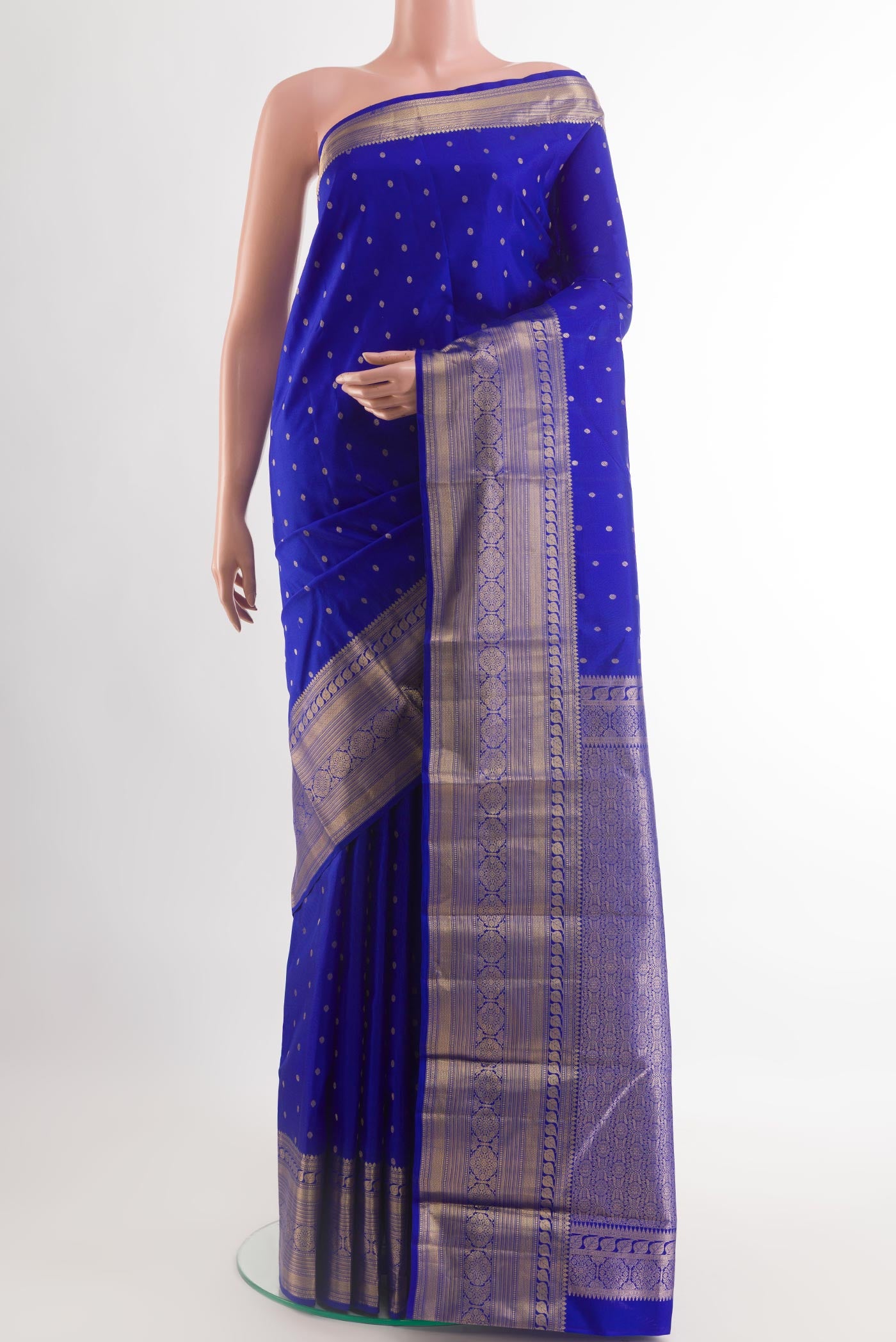 Blue Kanchipuram Silk Saree with Zari Butta on the body and Zari Border.  displayed on a mannequin