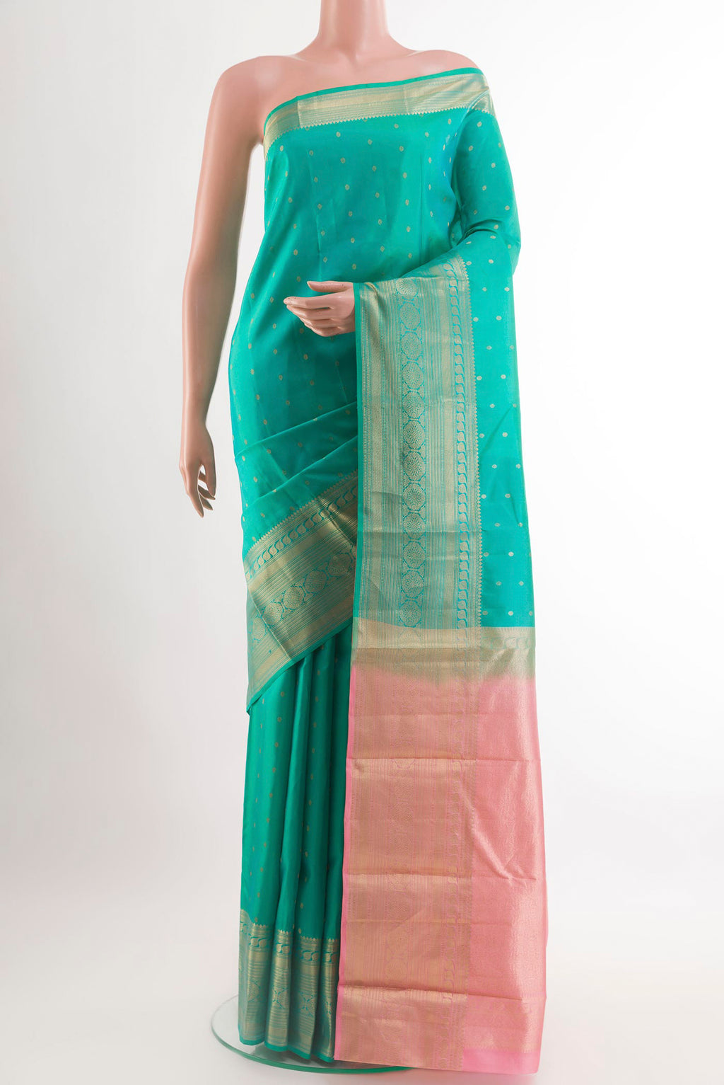 Sea Green Kanchipuram Silk Saree with Zari Brocade on the body and Zari Border.  displayed on a mannequin