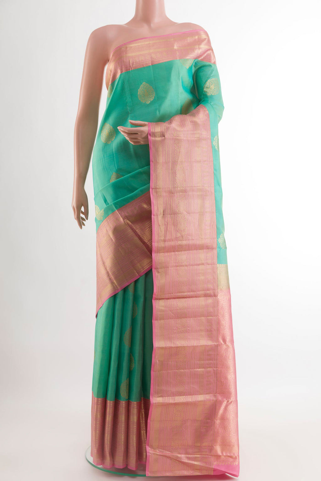 Sea Green Kanchipuram Silk Saree with Zari Butta on the body and Zari Border.  displayed on a mannequin