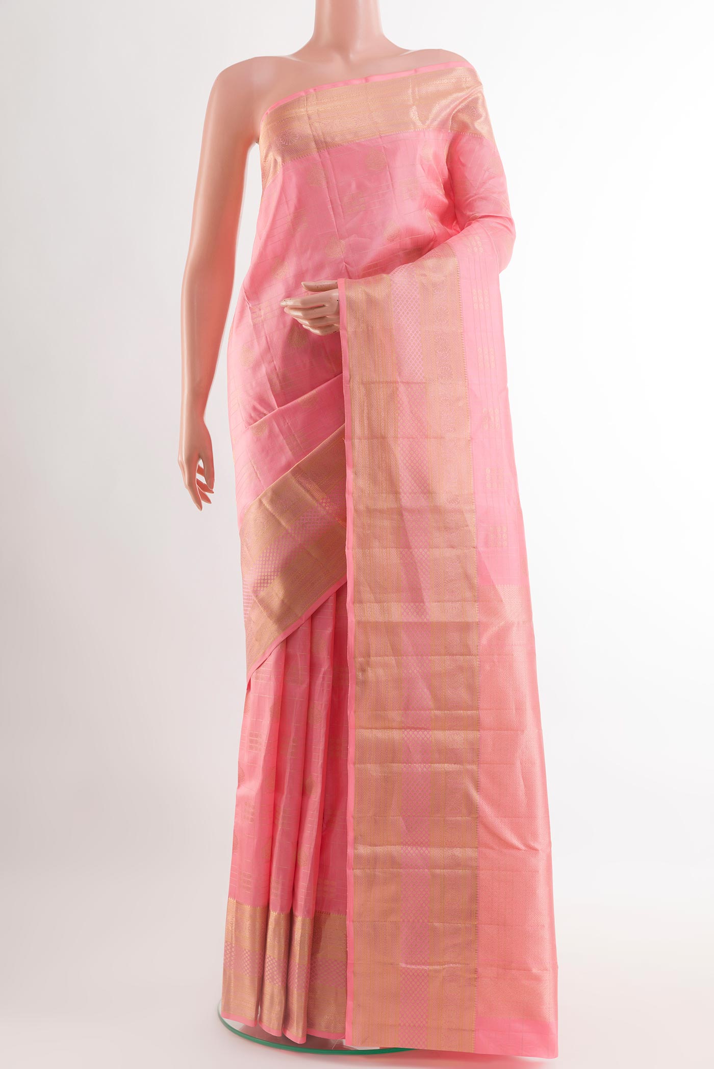 Pink Kanjivaram Silk Saree with Zari Butta on the body and Zari Border.  displayed on a mannequin