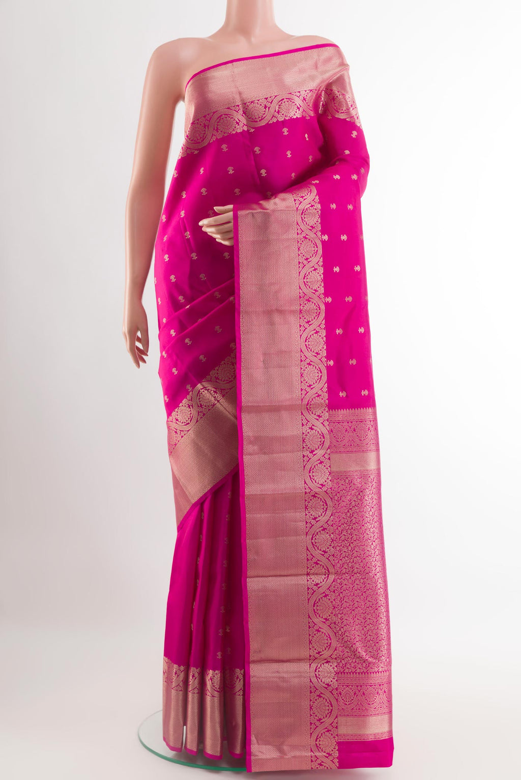 Pink Kanchipuram Silk Saree with Zari Butta on the body and Zari Border.  displayed on a mannequin