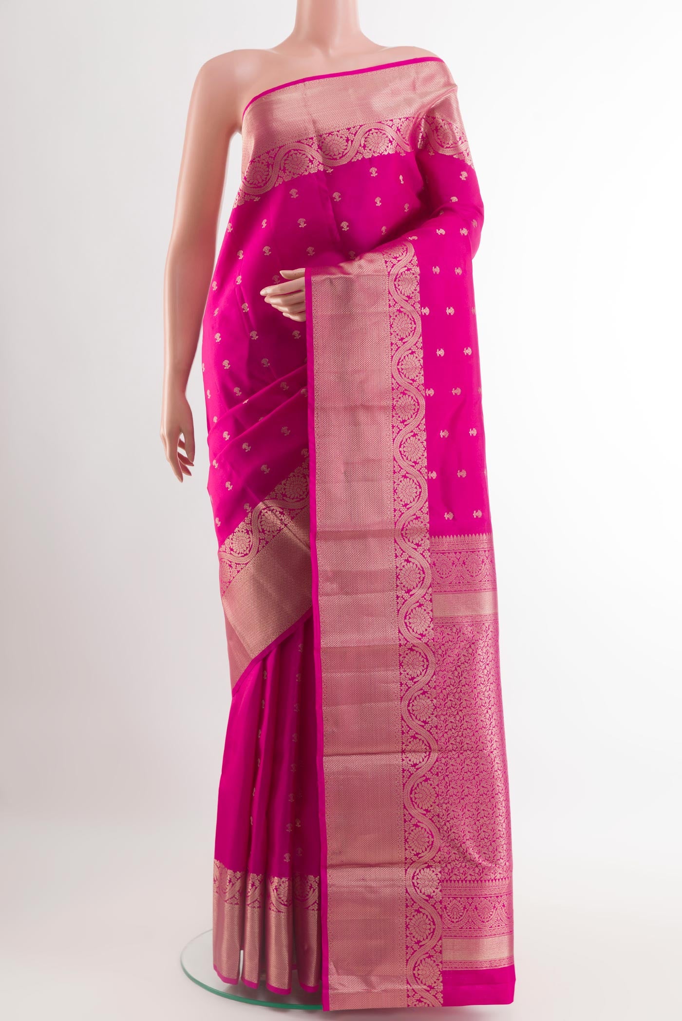 Pink Kanchipuram Silk Saree with Zari Butta on the body and Zari Border.  displayed on a mannequin
