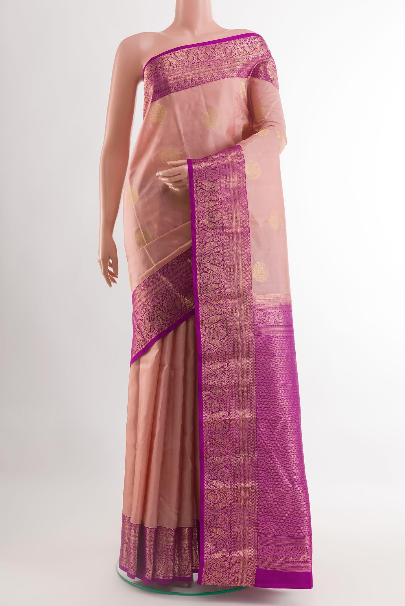 Pink Kanjivaram Silk Saree with Zari Brocade on the body and Zari Border.  displayed on a mannequin