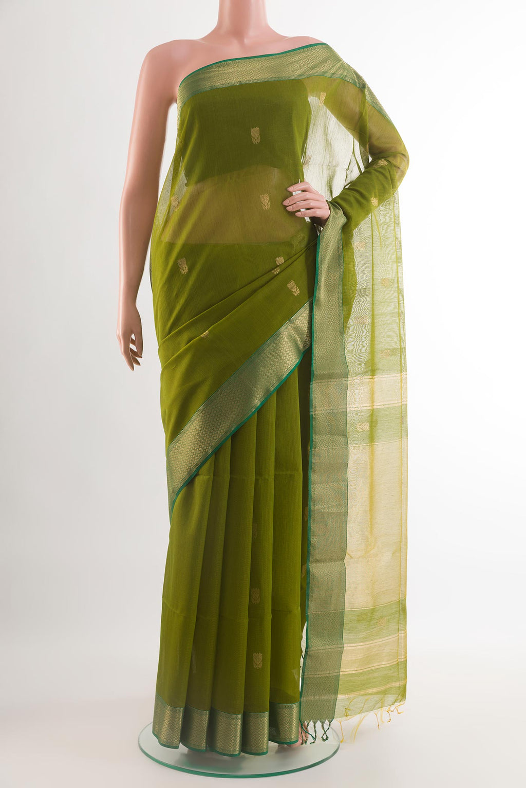 Green Blended Kora Silk Saree with Zari Butta on the body and Zari Border.  displayed on a mannequin