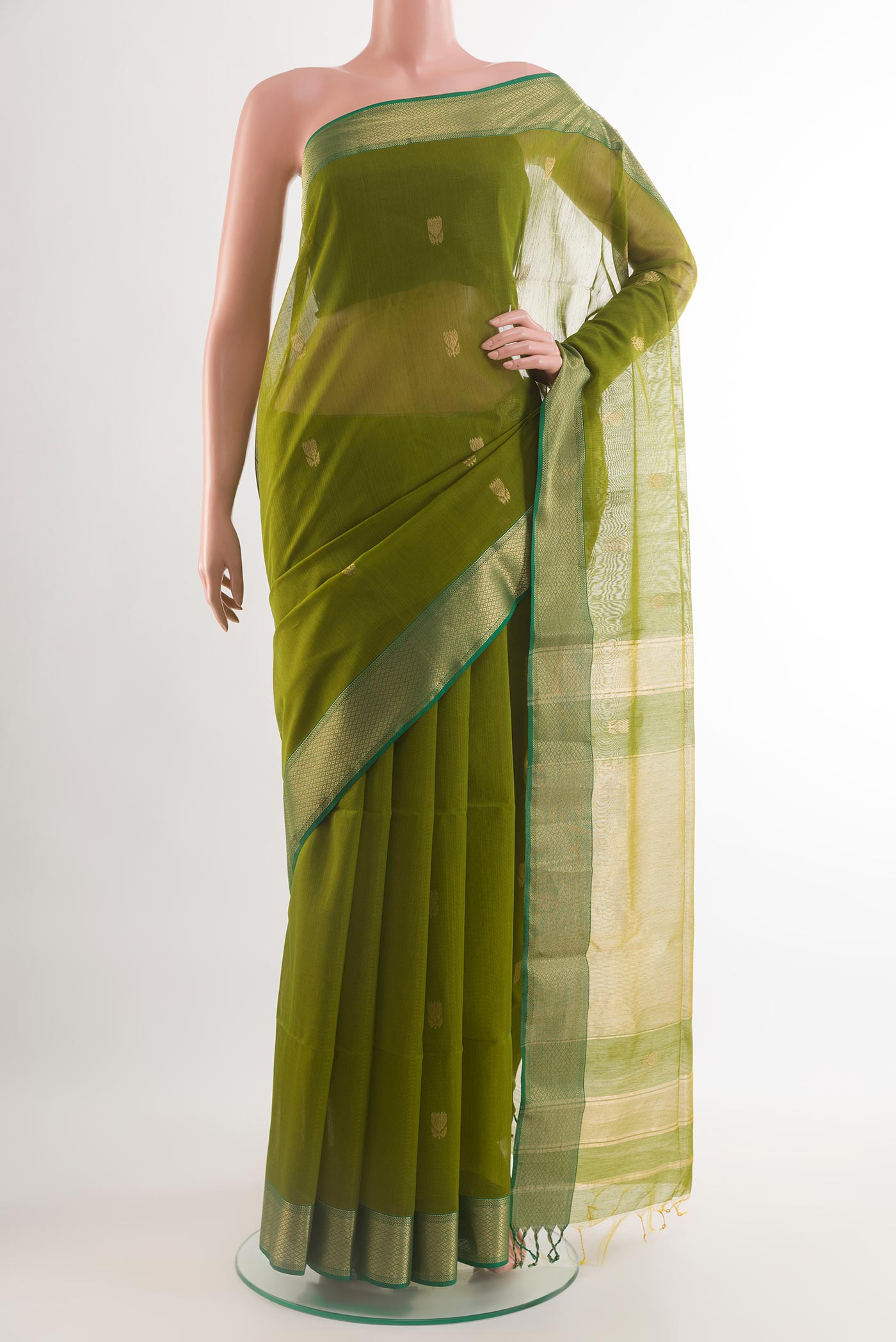 Green Blended Kora Silk Saree with Zari Butta on the body and Zari Border.  displayed on a mannequin