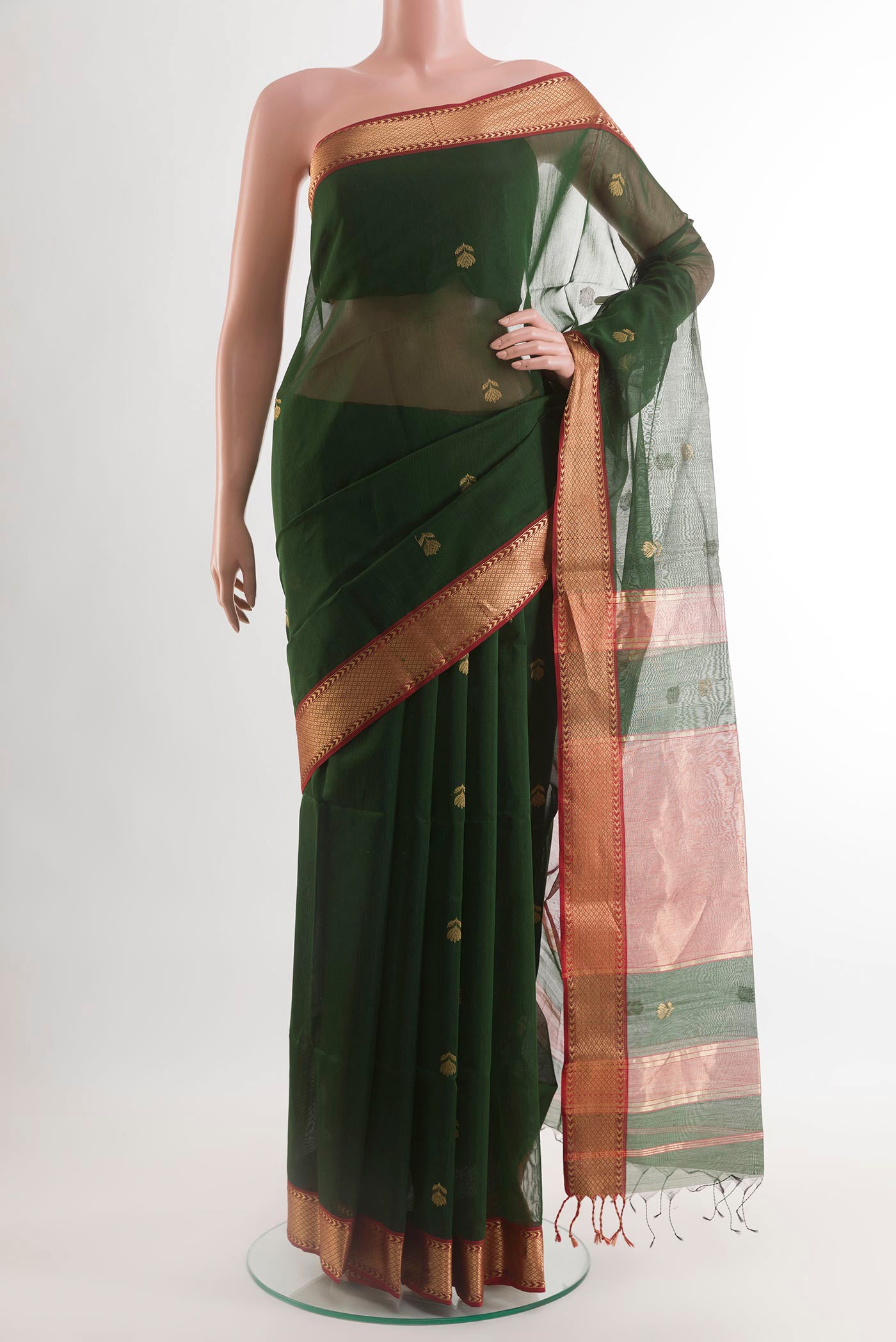 Green Blended Kora Cotton Saree with Zari Butta on the body and Zari Border.  displayed on a mannequin