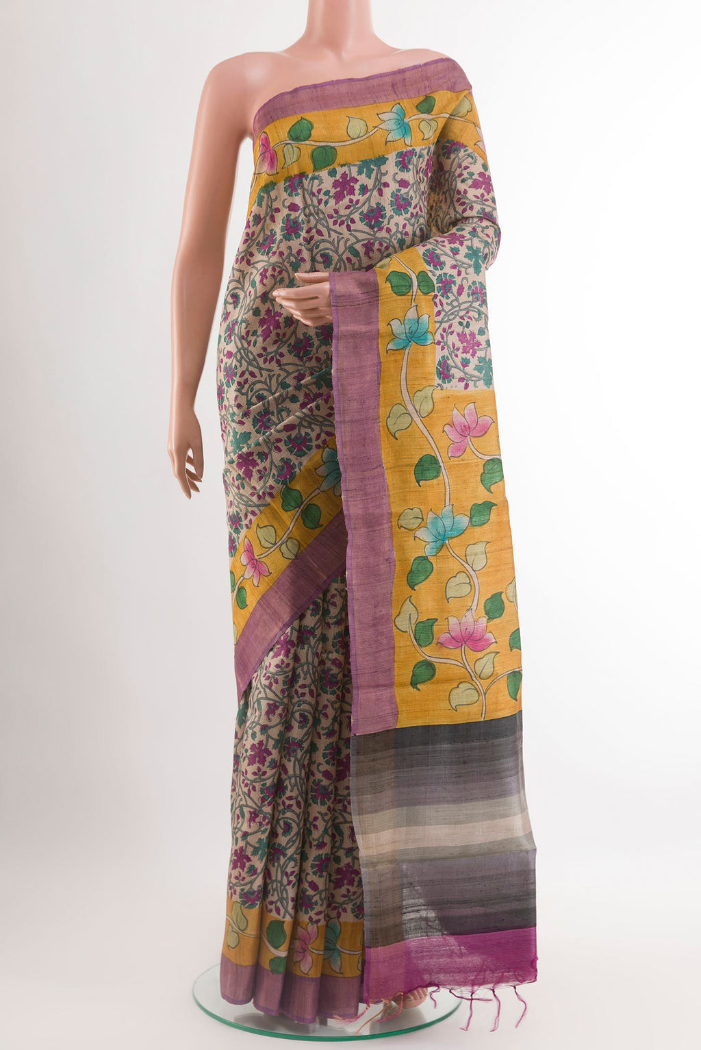 Cream Tussar Saree with Printed design on the body and Printed Border.  displayed on a mannequin