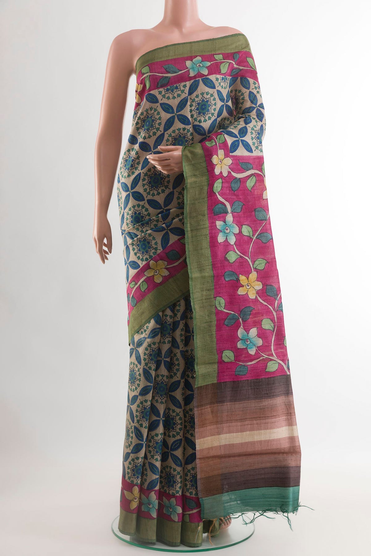 Multi Color Tussar Saree with Printed design on the body and Zari Border.  displayed on a mannequin