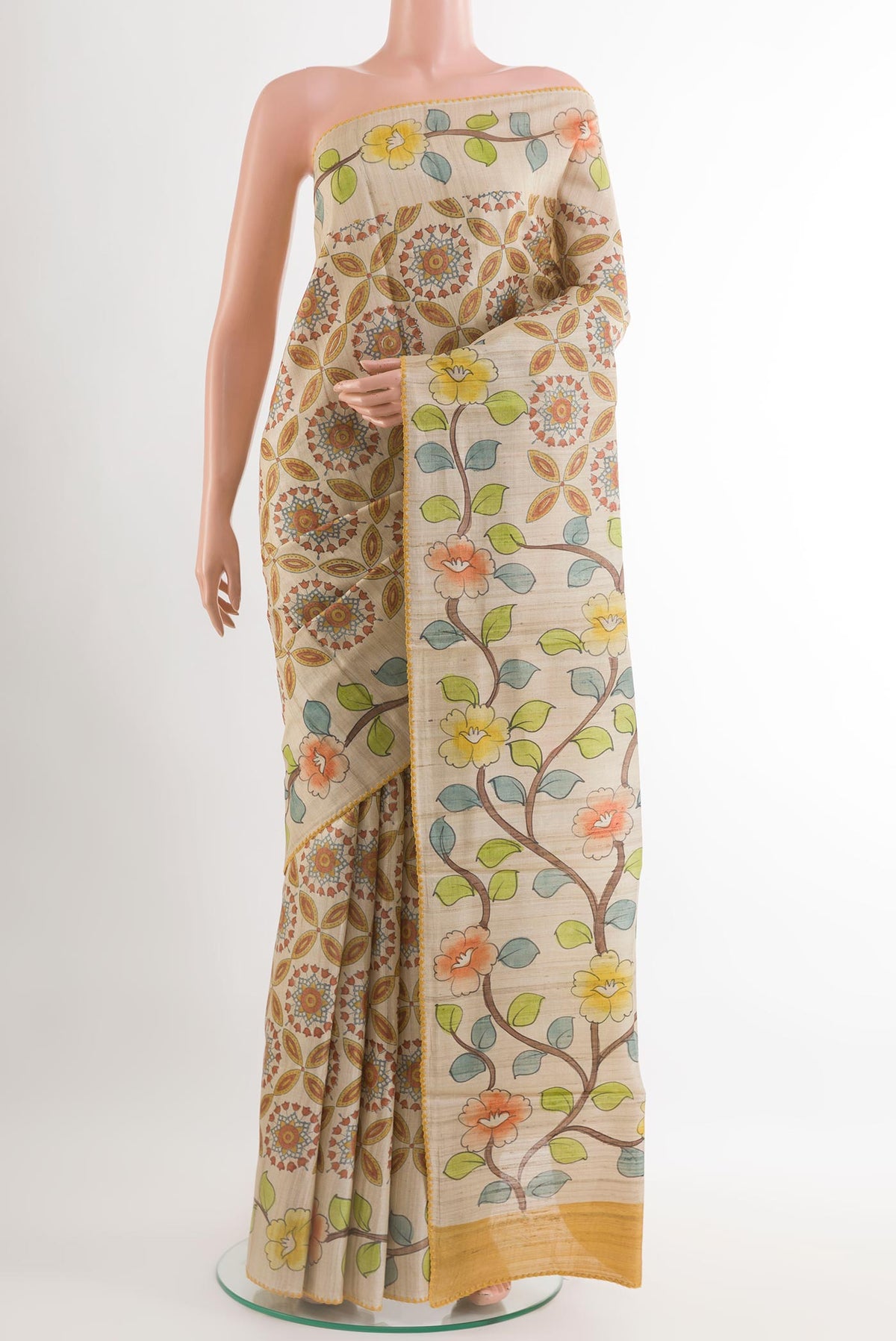 Yellow Tussar Saree with Printed design on the body and Embroidery Border.  displayed on a mannequin