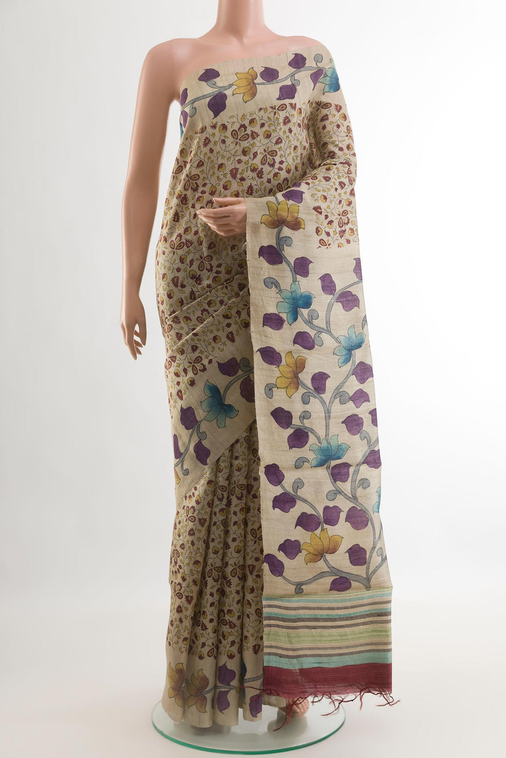 Beige Tussar Silk Saree with Printed design on the body and Without Border.  displayed on a mannequin