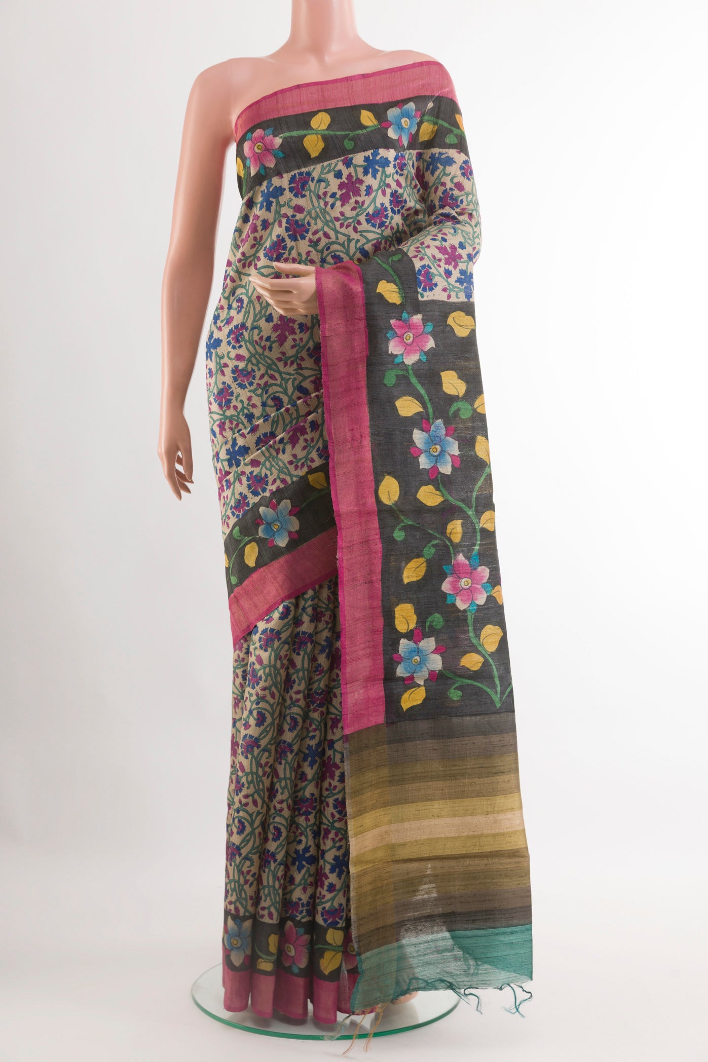 Multi Color Tussar Saree with Printed design on the body and Zari Border.  displayed on a mannequin