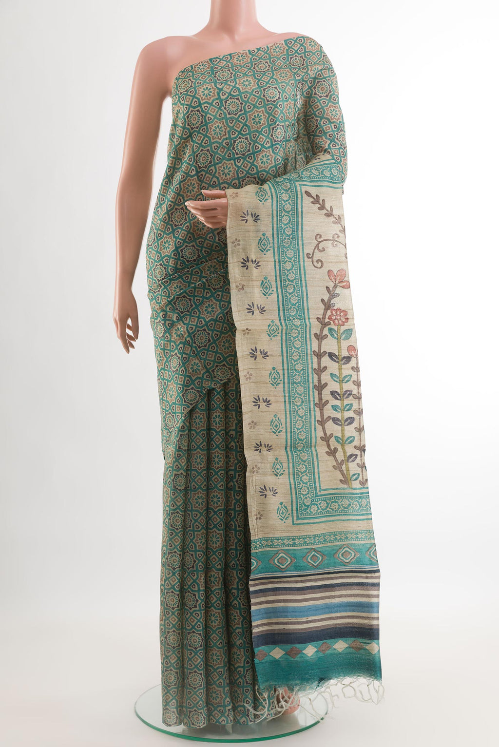 Teal Tussar Silk Saree with Printed design on the body and Without Border.  displayed on a mannequin