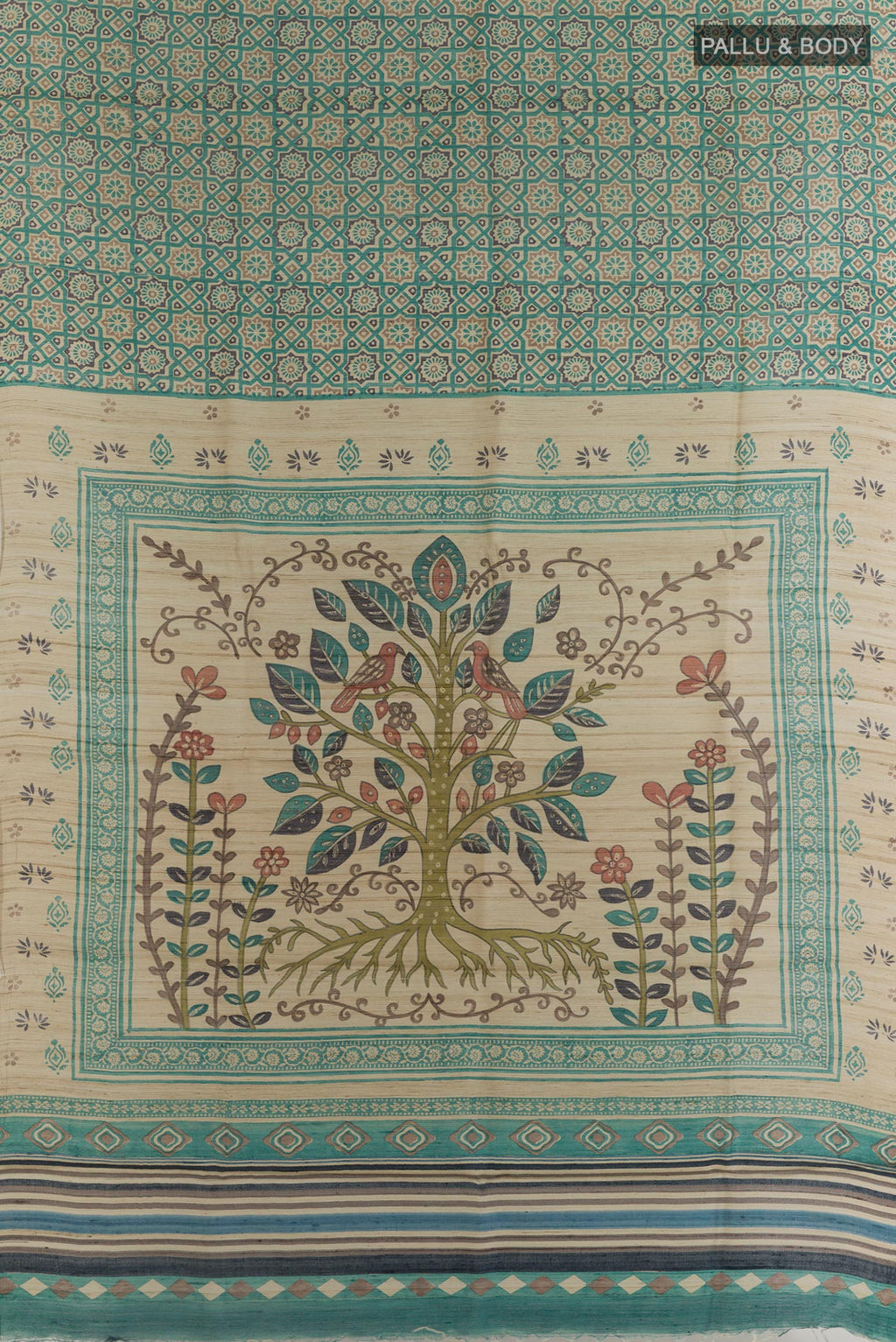 Flat view of Teal Tussar Silk Saree with Printed design on the body and Without Border. 