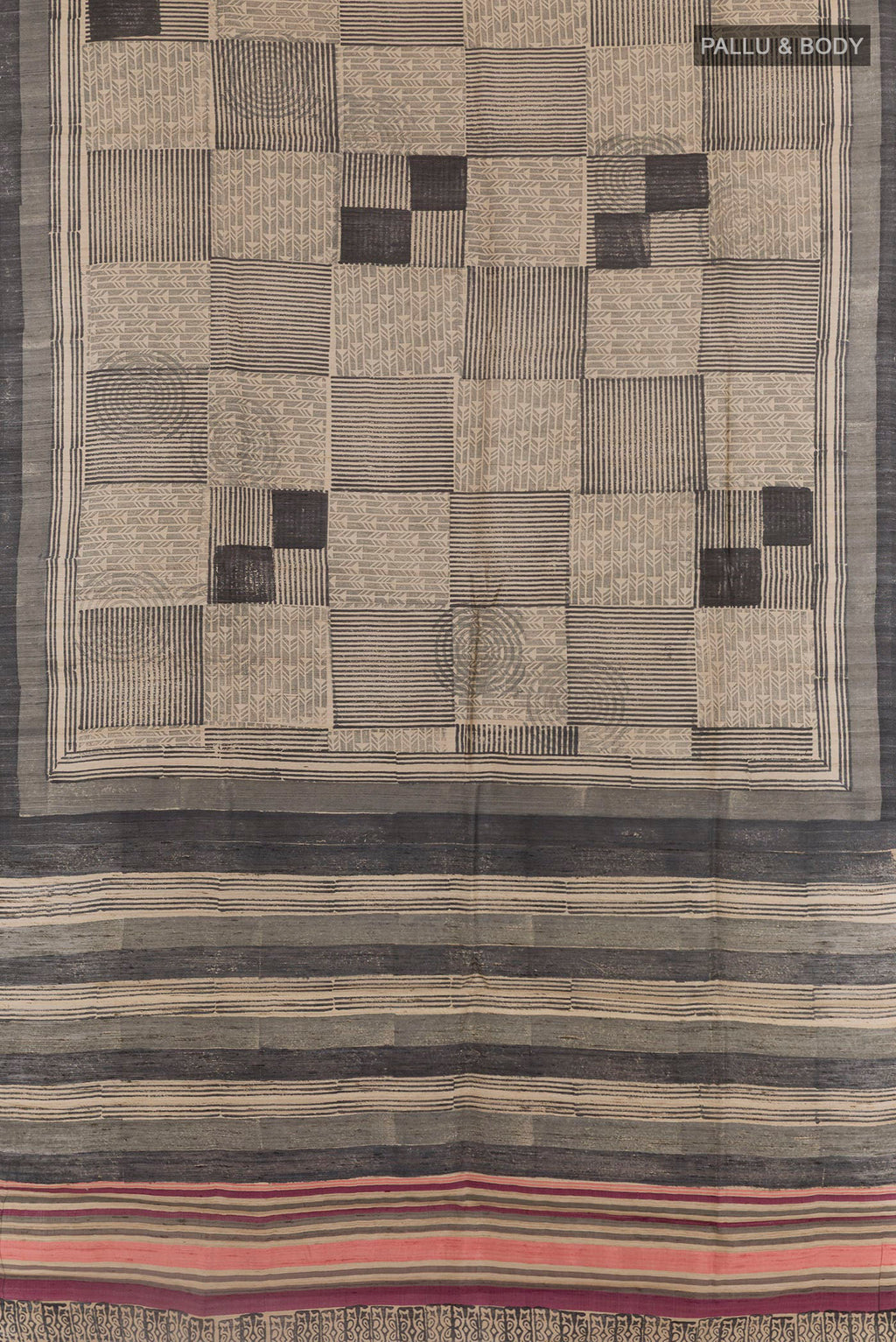 Flat view of Black Tussar Saree with Printed design on the body and Printed Border. 