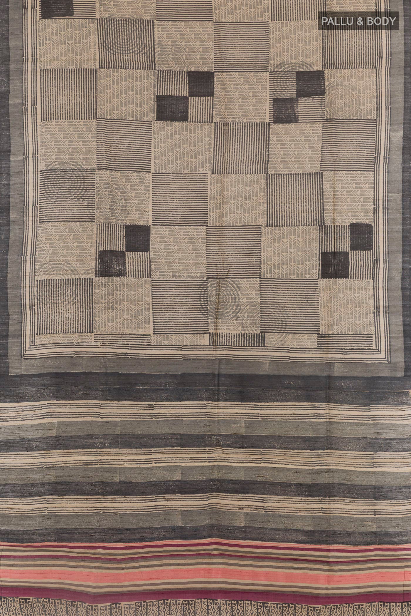Flat view of Black Tussar Saree with Printed design on the body and Printed Border. 
