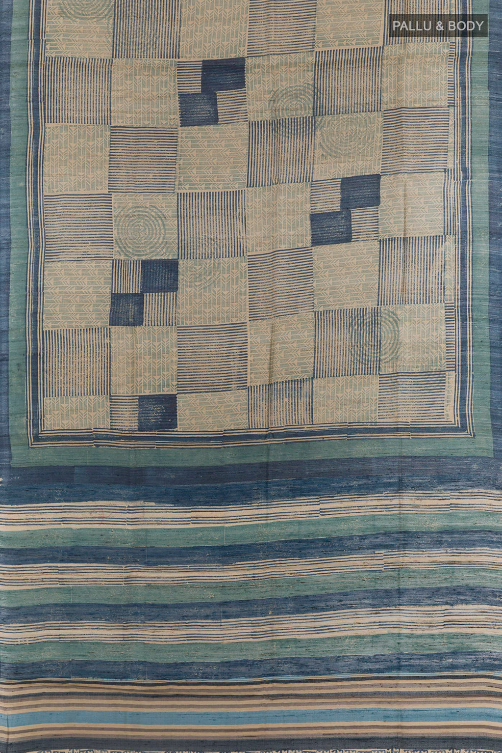 Flat view of Blue Tussar Saree with Printed design on the body and Printed Border. 