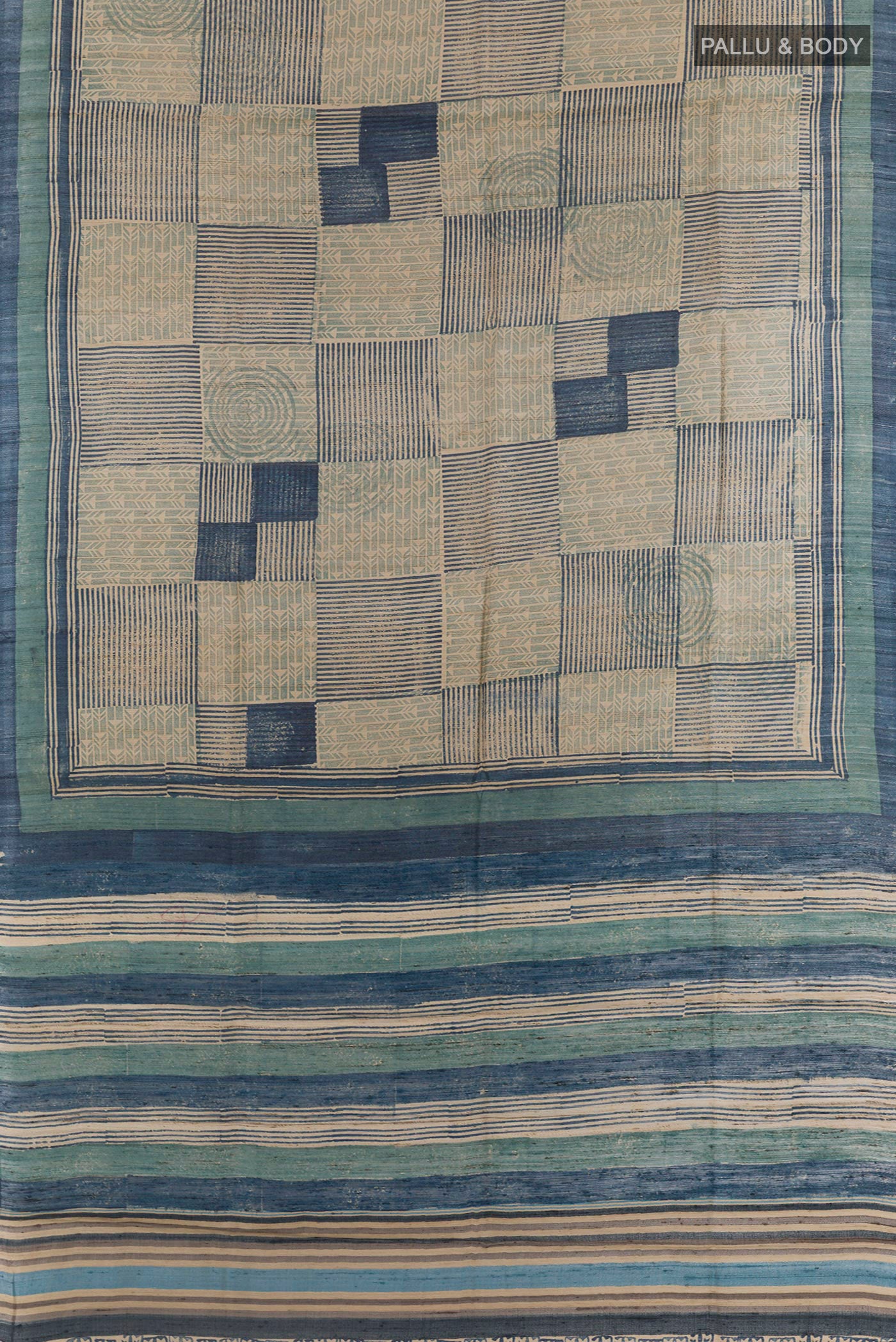 Flat view of Blue Tussar Saree with Printed design on the body and Printed Border. 