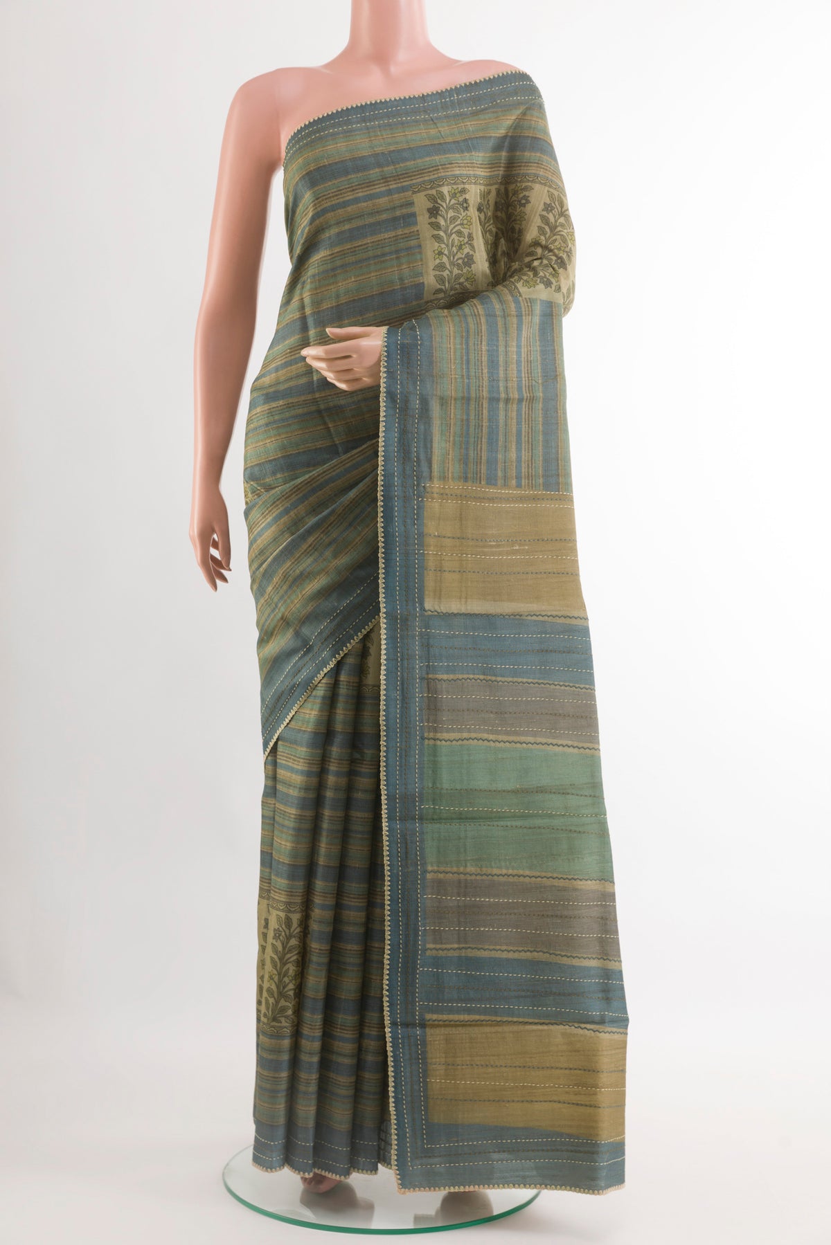 Blue Tussar Saree with Printed design on the body and Zari Border.  displayed on a mannequin