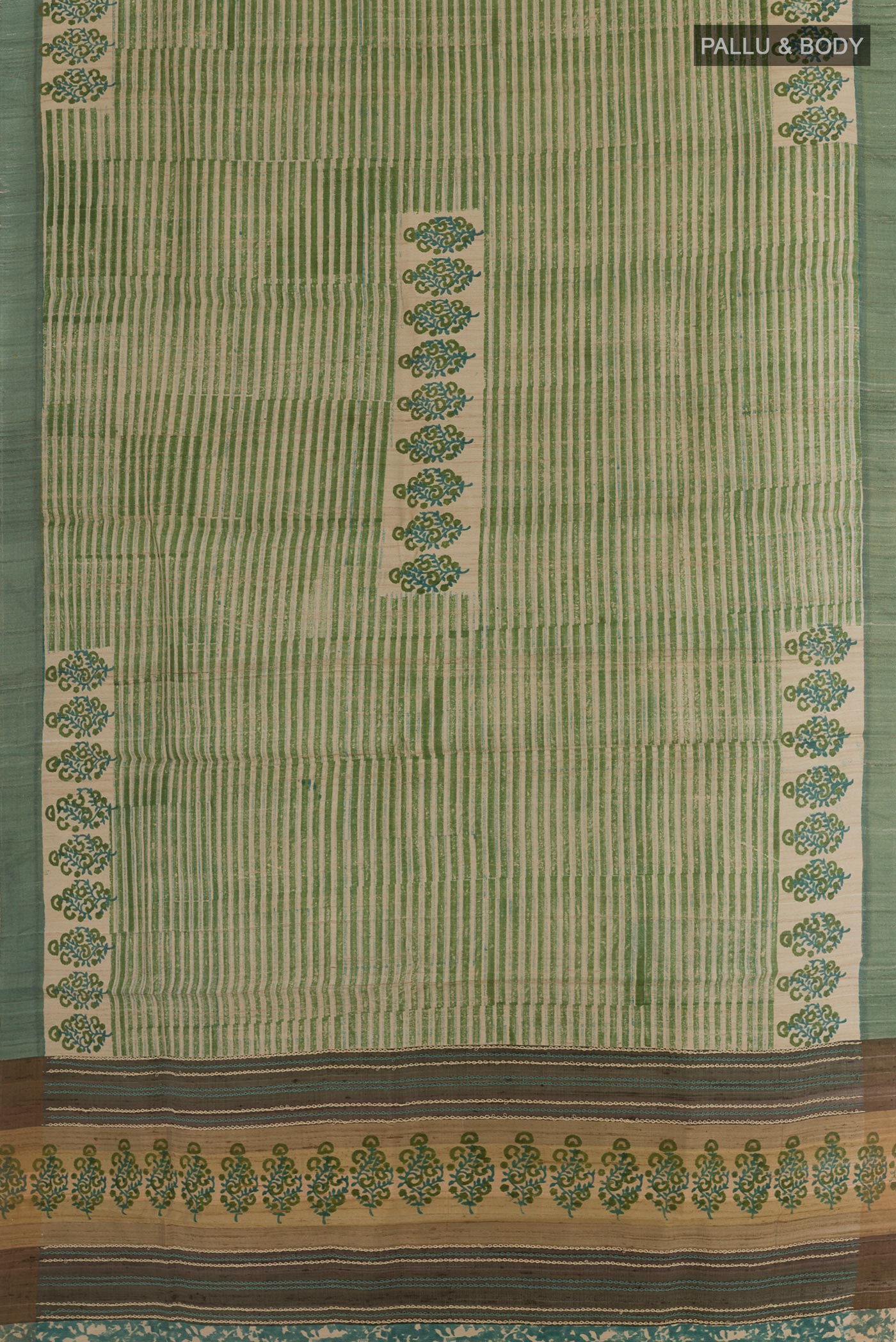 Flat view of Green Tussar Silk Saree with Printed design on the body and Printed Border. 