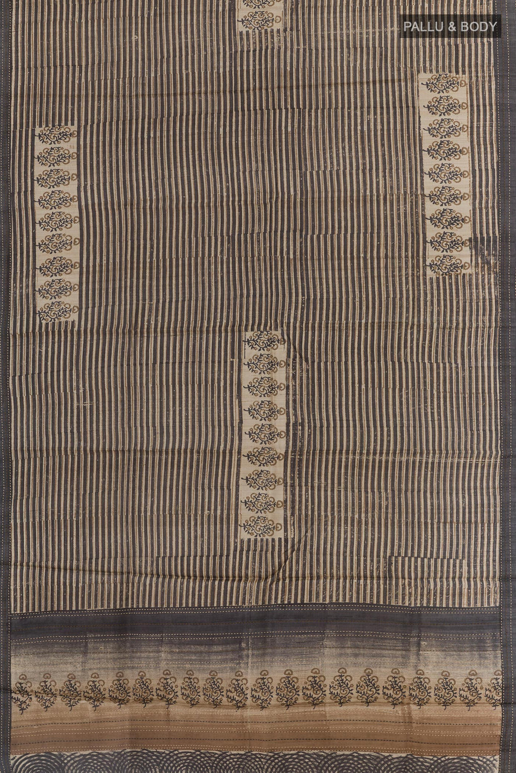 Flat view of Black Tussar Saree with Printed design on the body and Embroidery Border. 