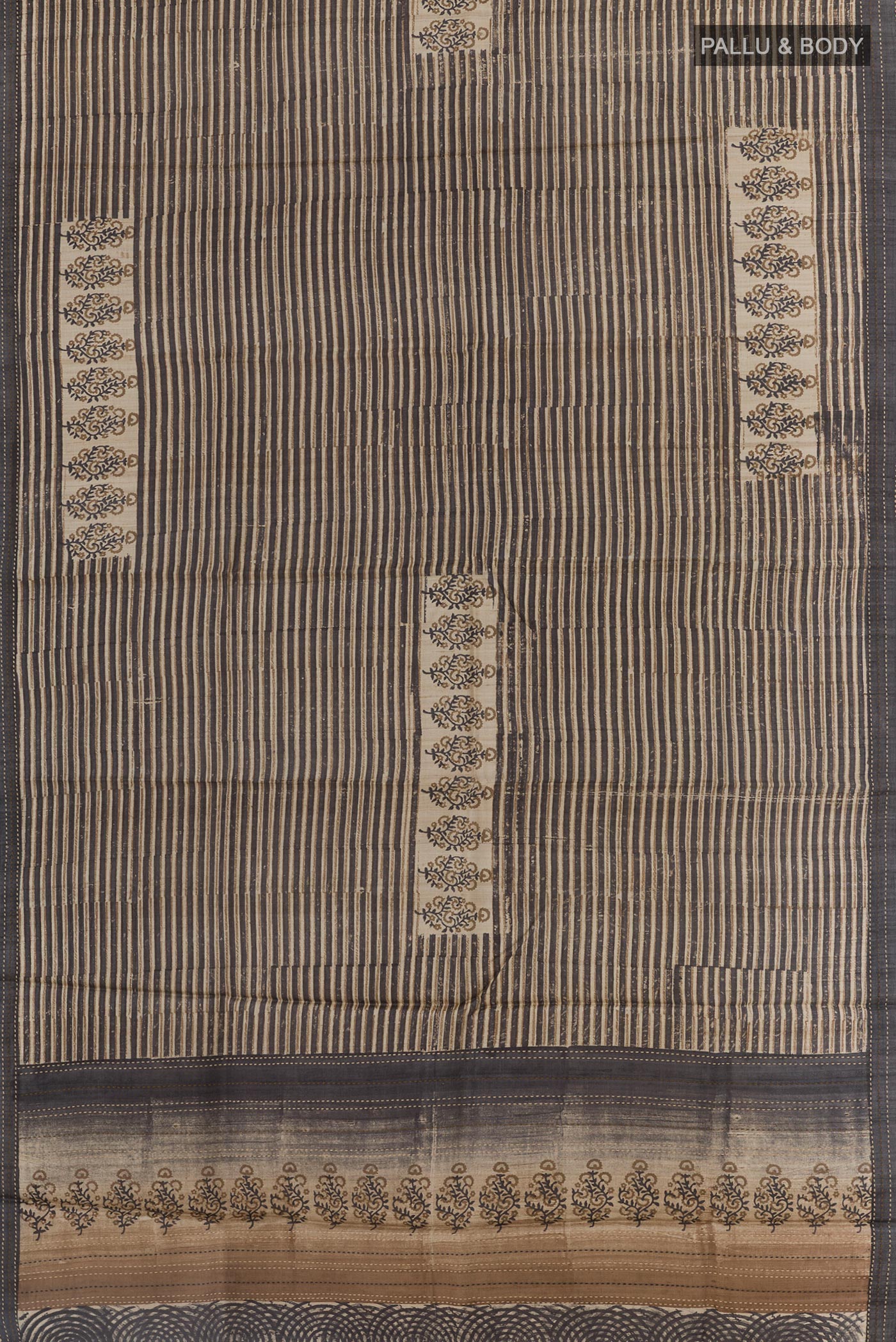 Flat view of Black Tussar Saree with Printed design on the body and Embroidery Border. 