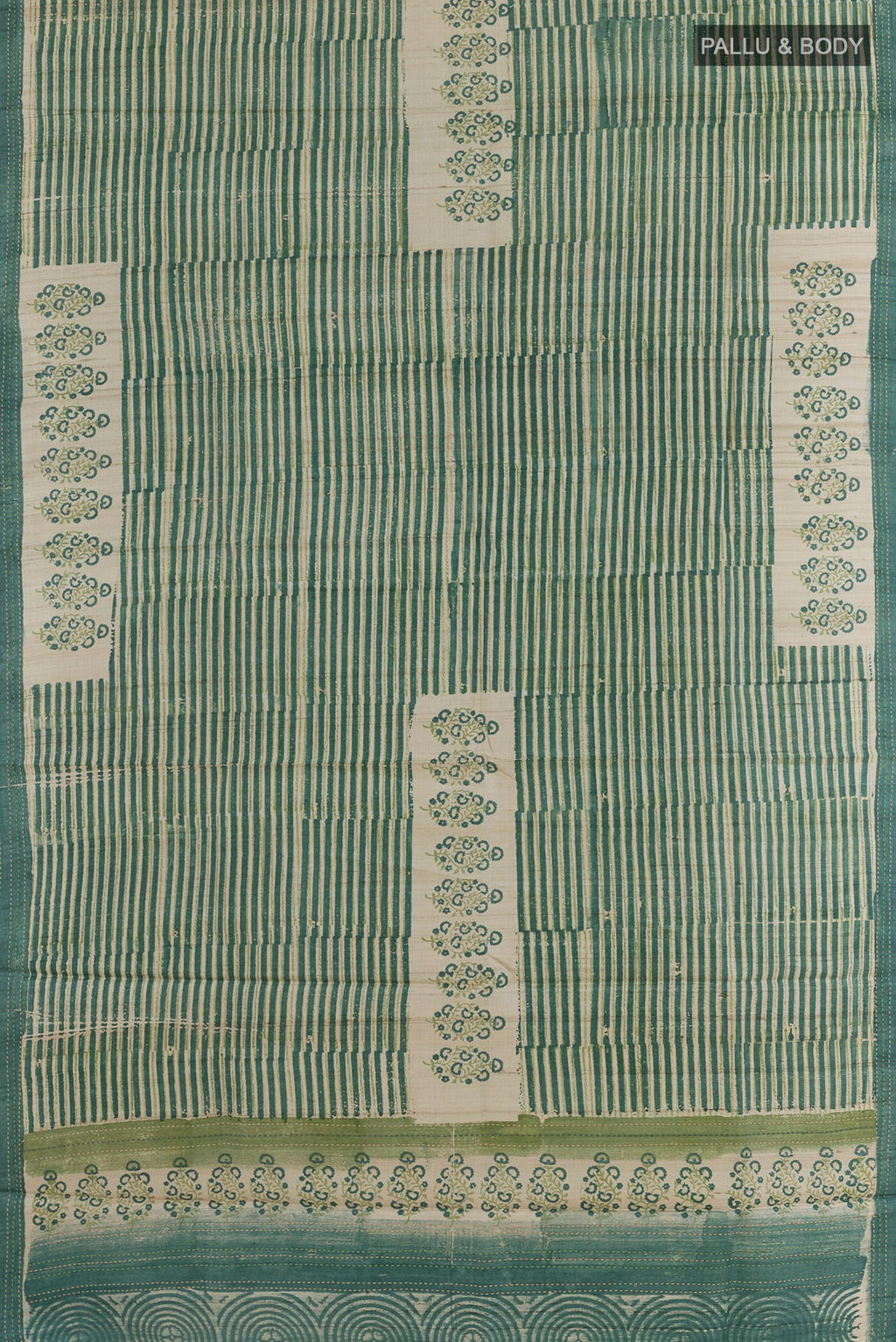 Flat view of Green Tussar Silk Saree with Printed design on the body and Printed Border. 