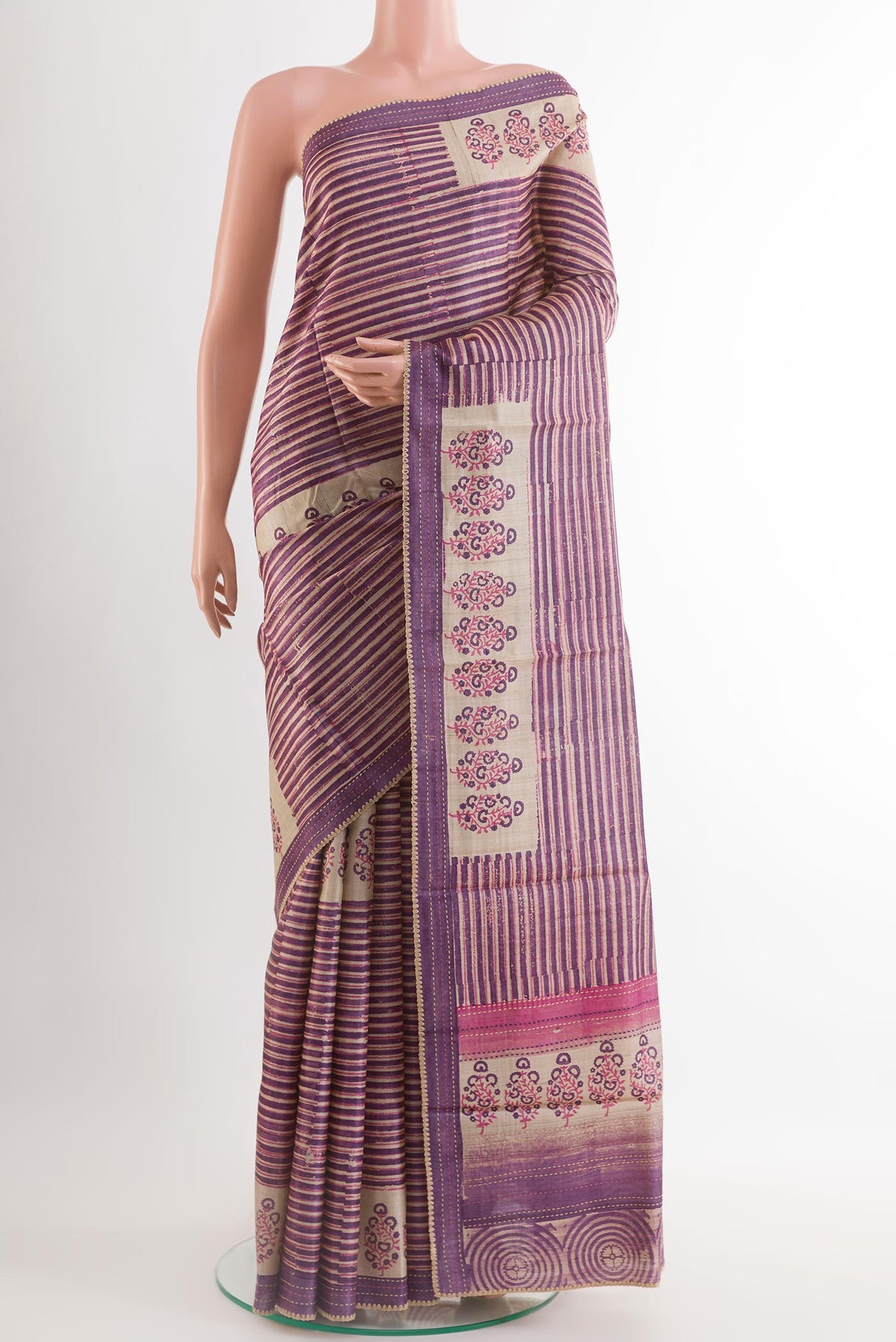 Purple Tussar Saree with Printed design on the body and Embroidery Border.  displayed on a mannequin