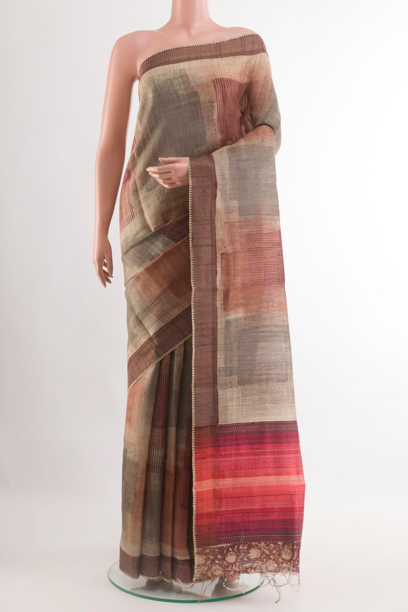 Multi Color Tussar Saree with Printed design on the body and Zari Border.  displayed on a mannequin