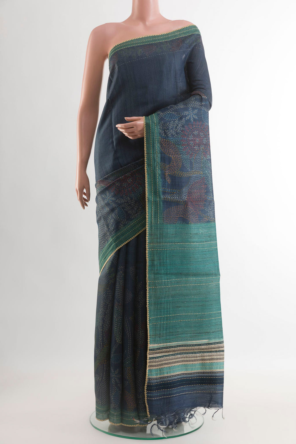 Blue Tussar Saree with Printed design on the body and Embroidery Border.  displayed on a mannequin