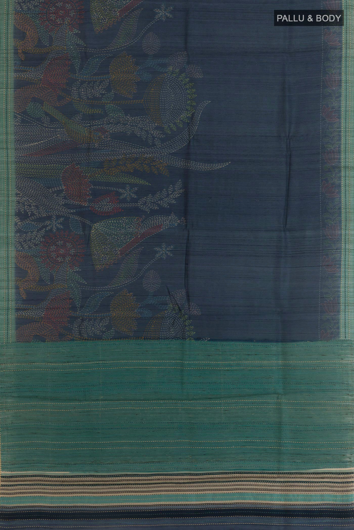 Flat view of Blue Tussar Saree with Printed design on the body and Embroidery Border. 