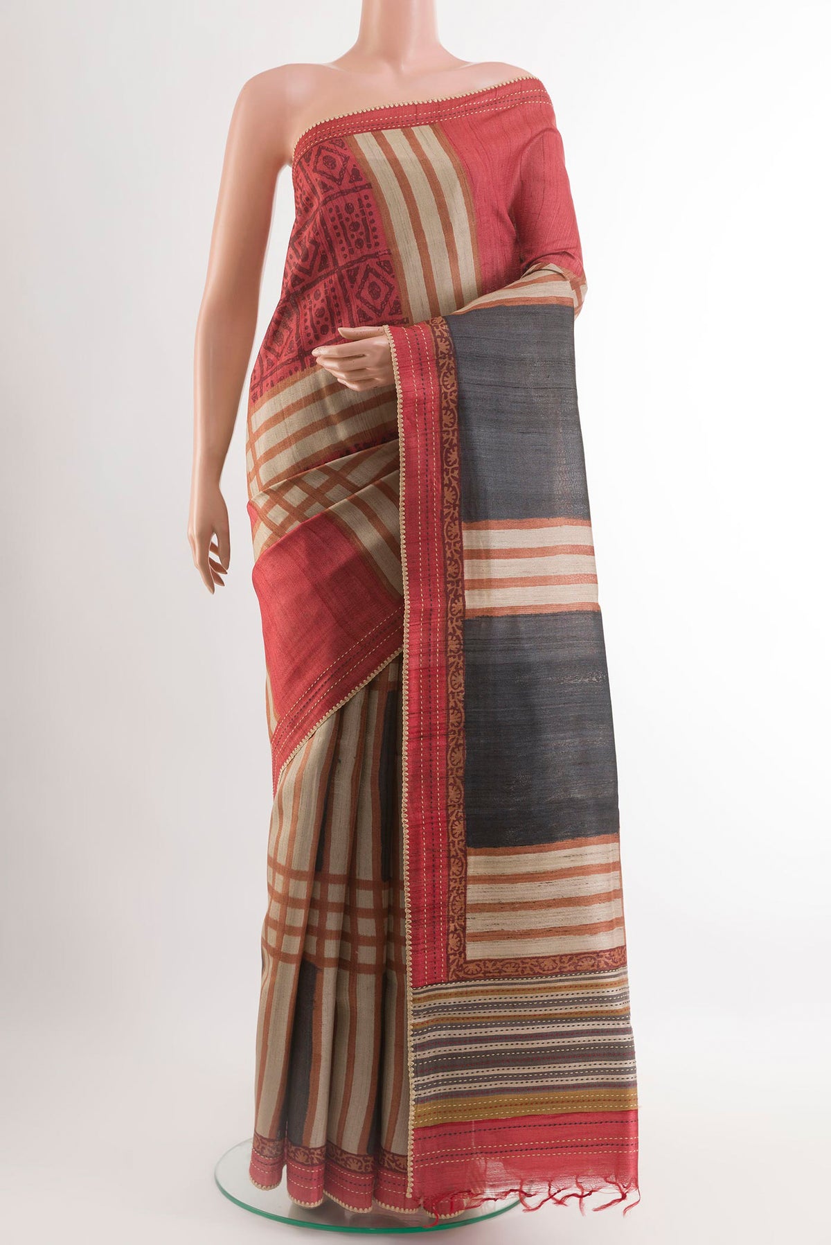 Multi Color Tussar Saree with Printed design on the body and Embroidery Border.  displayed on a mannequin
