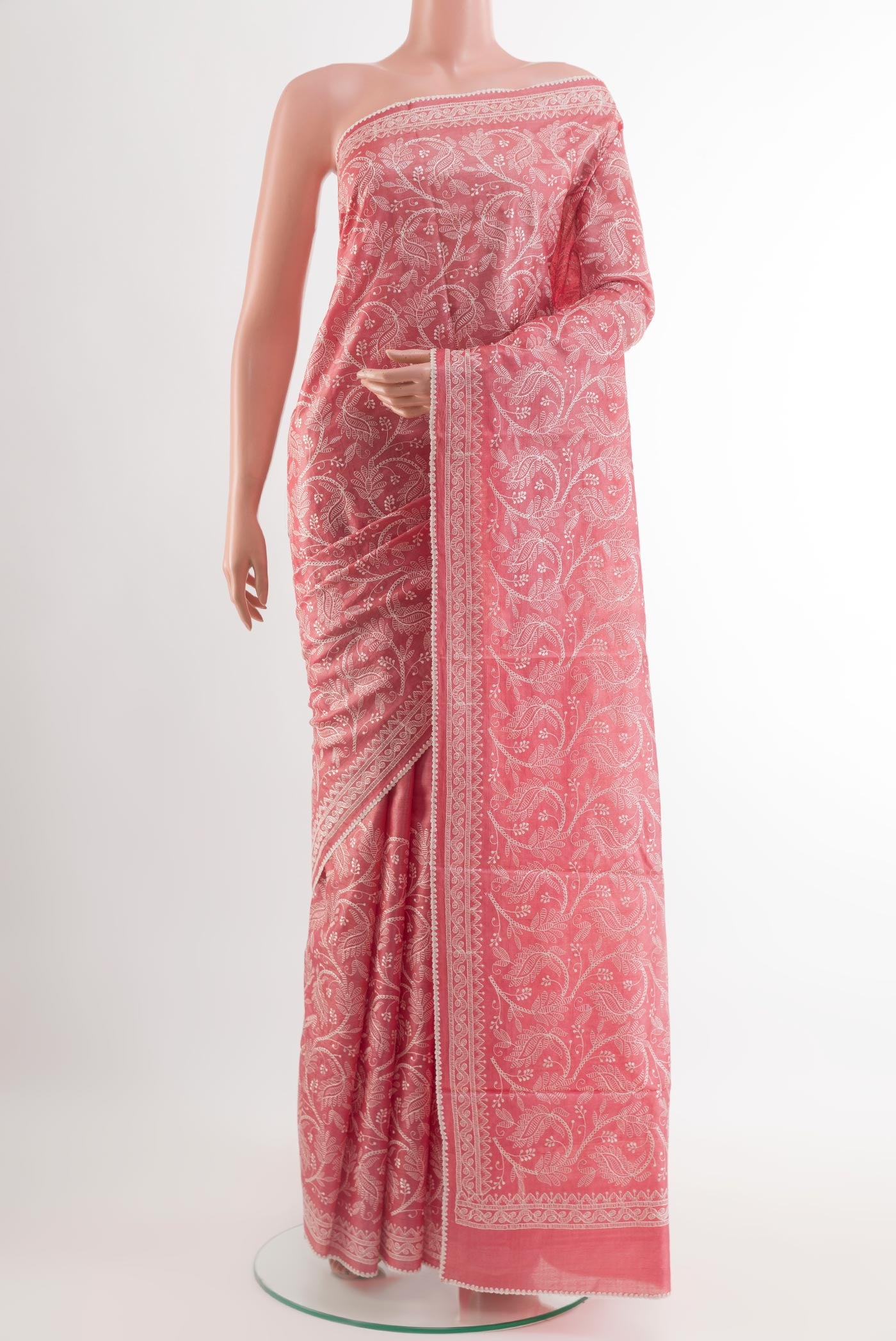 Pink Tussar Saree with Embroidery on the body and Embroidery Border.  displayed on a mannequin