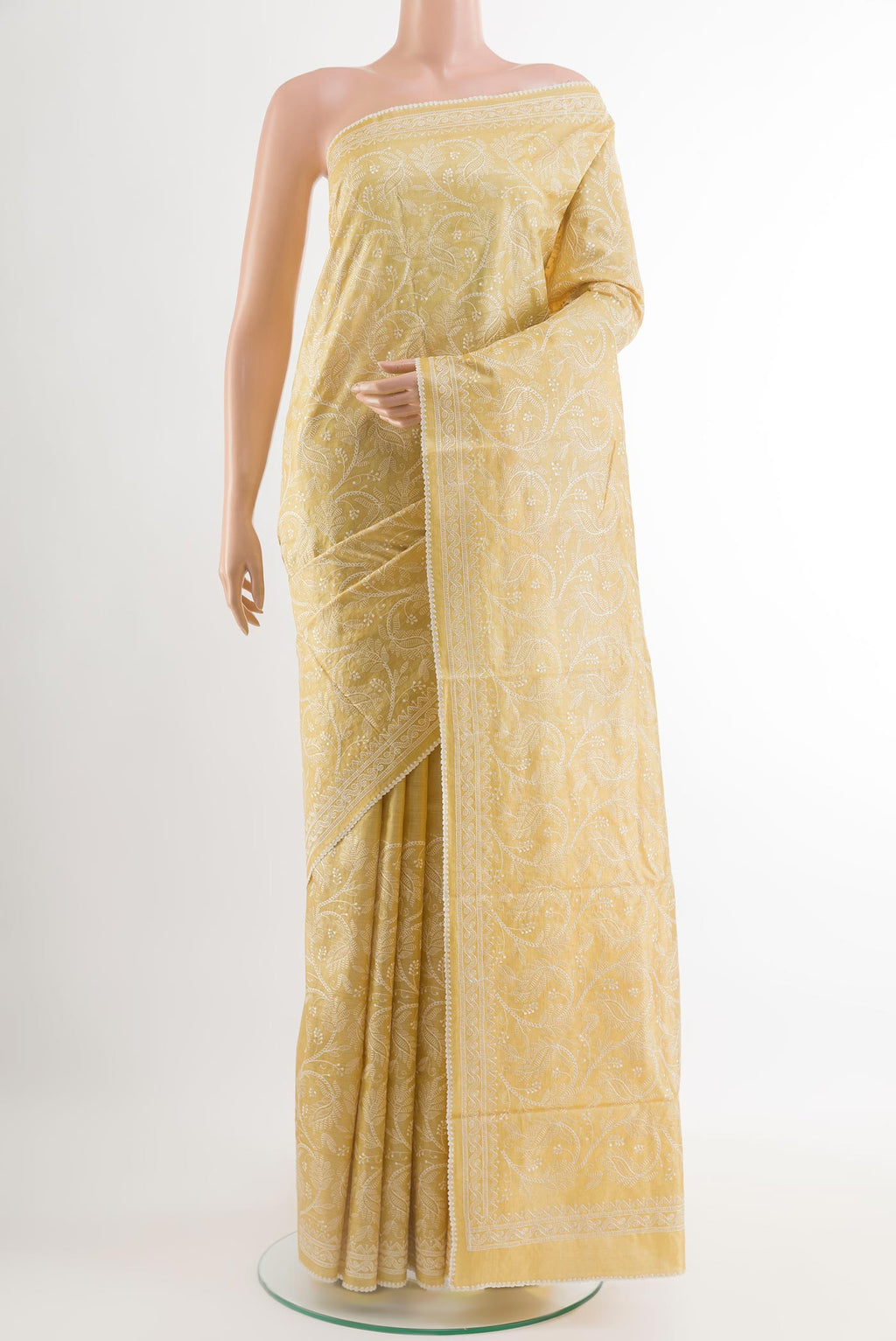 Yellow Tussar Saree with Embroidery on the body and Embroidery Border.  displayed on a mannequin
