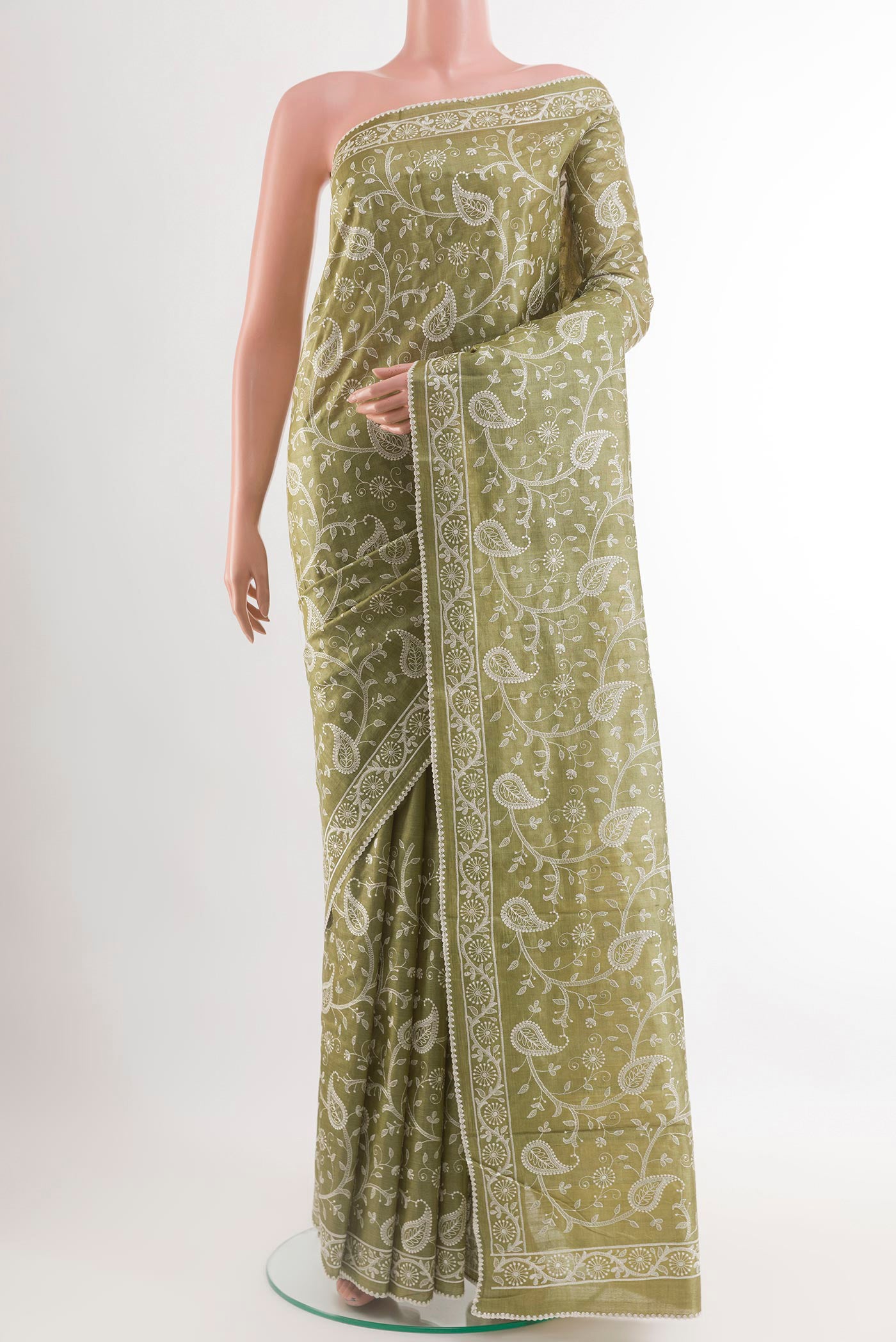 Mehandi Green Tussar Saree with Embroidery on the body and Embroidery Border.  displayed on a mannequin