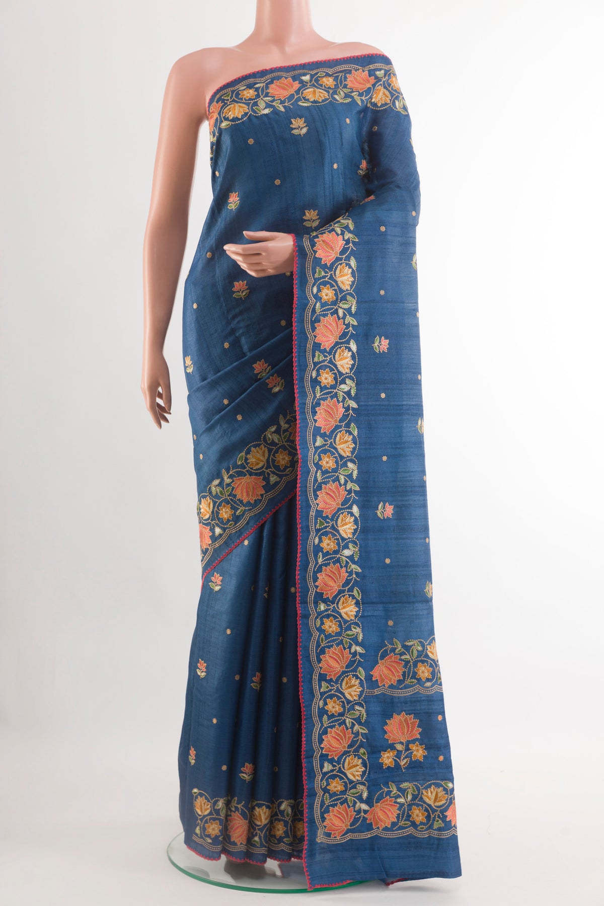 Blue Tussar Saree with Thread Butta on the body and Zari Border.  displayed on a mannequin
