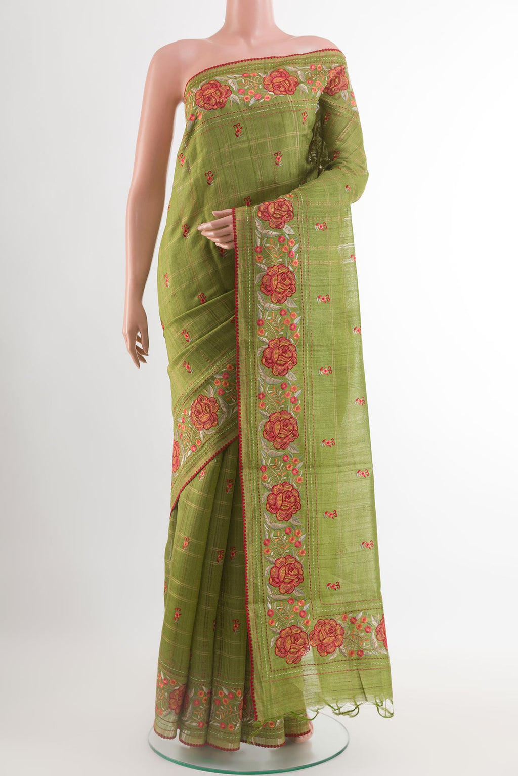 Green Tussar Saree with Thread Butta on the body and Embroidery Border.  displayed on a mannequin