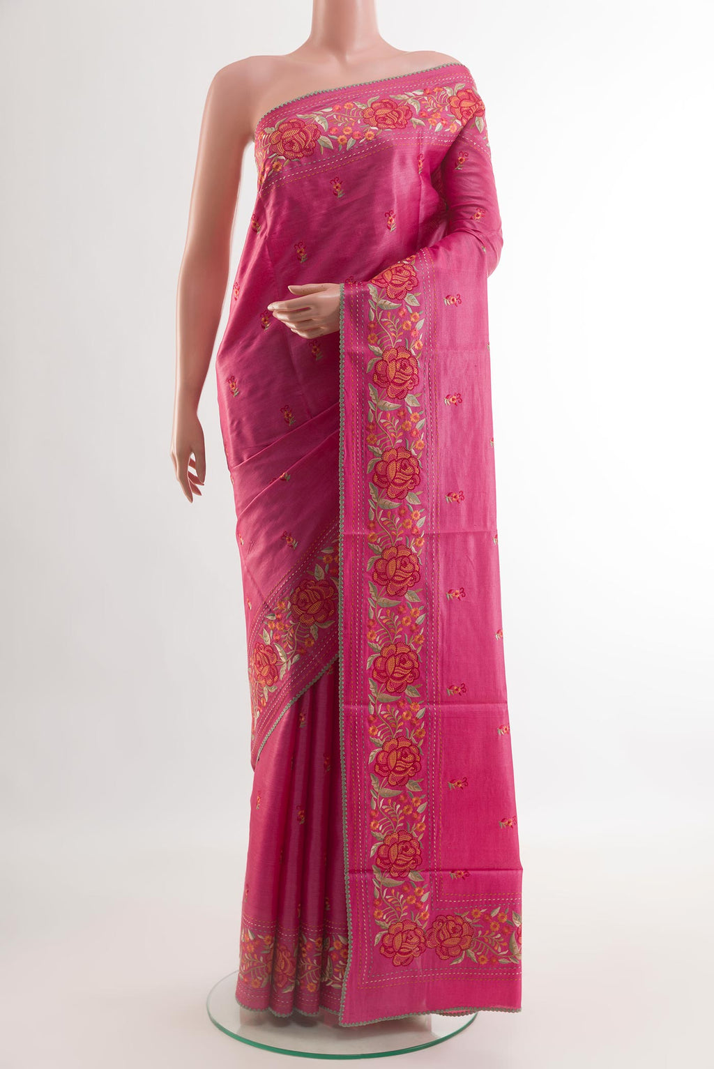 Pink Tussar Silk Saree with Embroidery on the body and Embroidery Border.  displayed on a mannequin