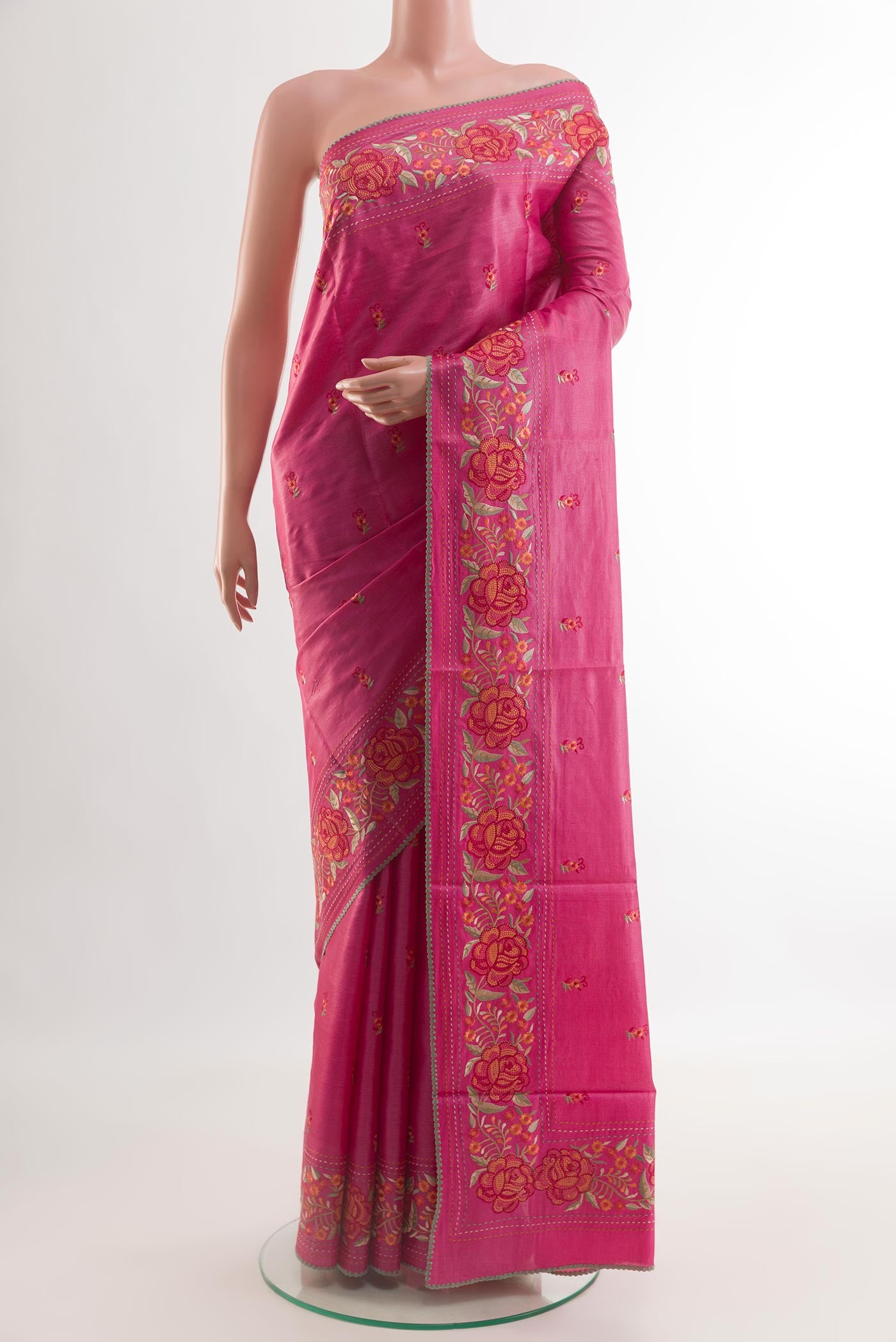 Pink Tussar Silk Saree with Embroidery on the body and Embroidery Border.  displayed on a mannequin
