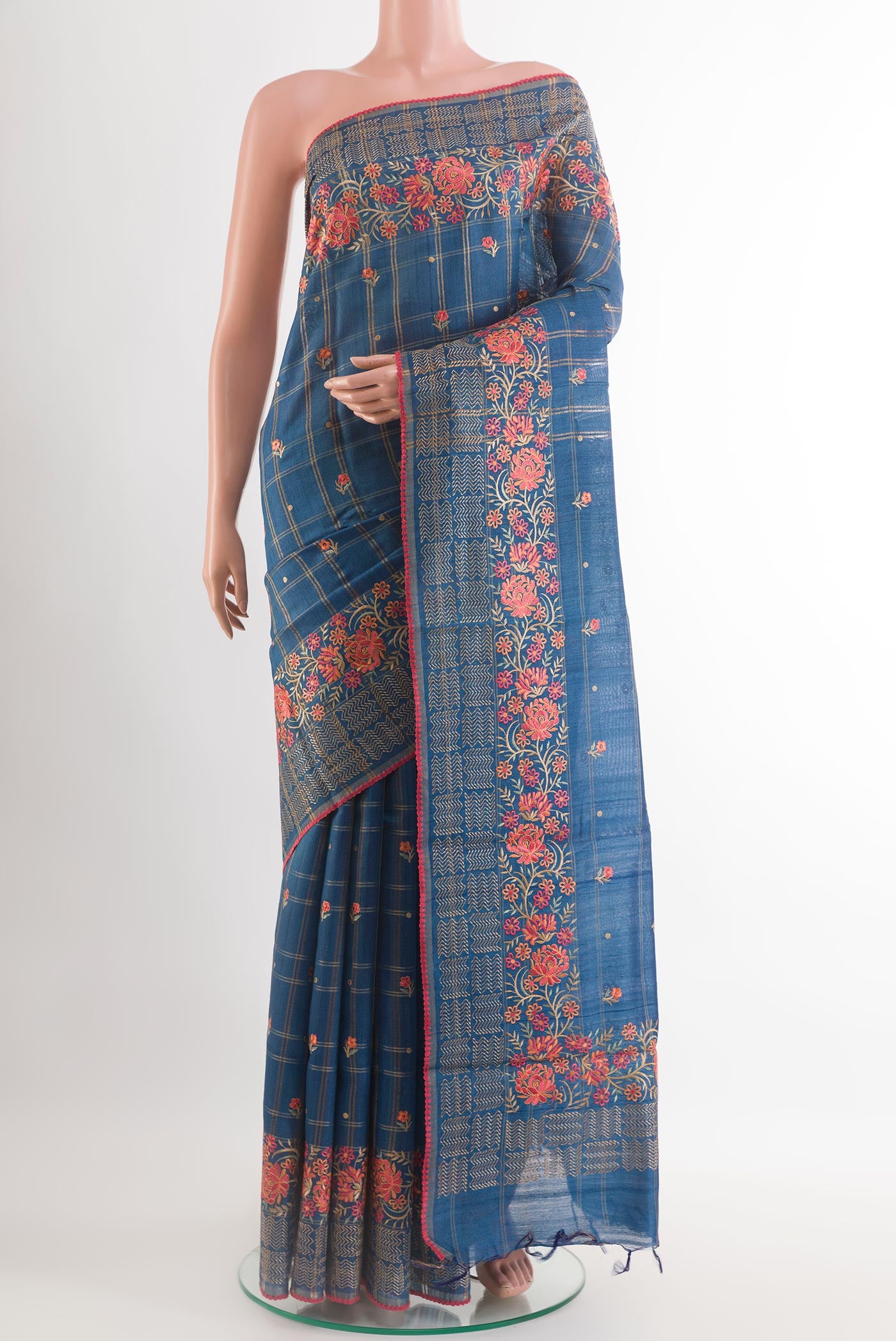 Blue Tussar Saree with Thread Butta on the body and Embroidery Border.  displayed on a mannequin