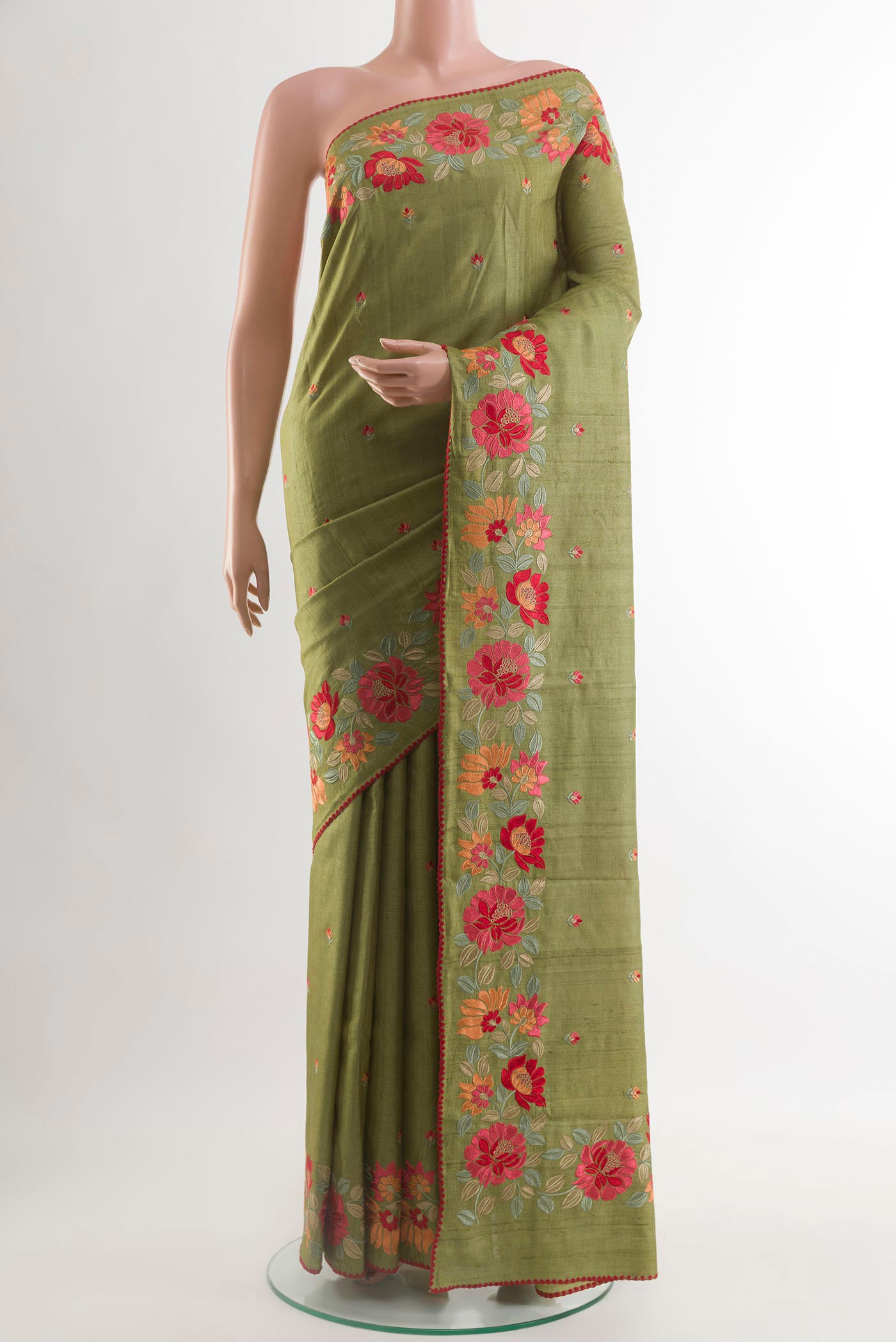 Olive Green Tussar Saree with Thread Butta on the body and Embroidery Border.  displayed on a mannequin