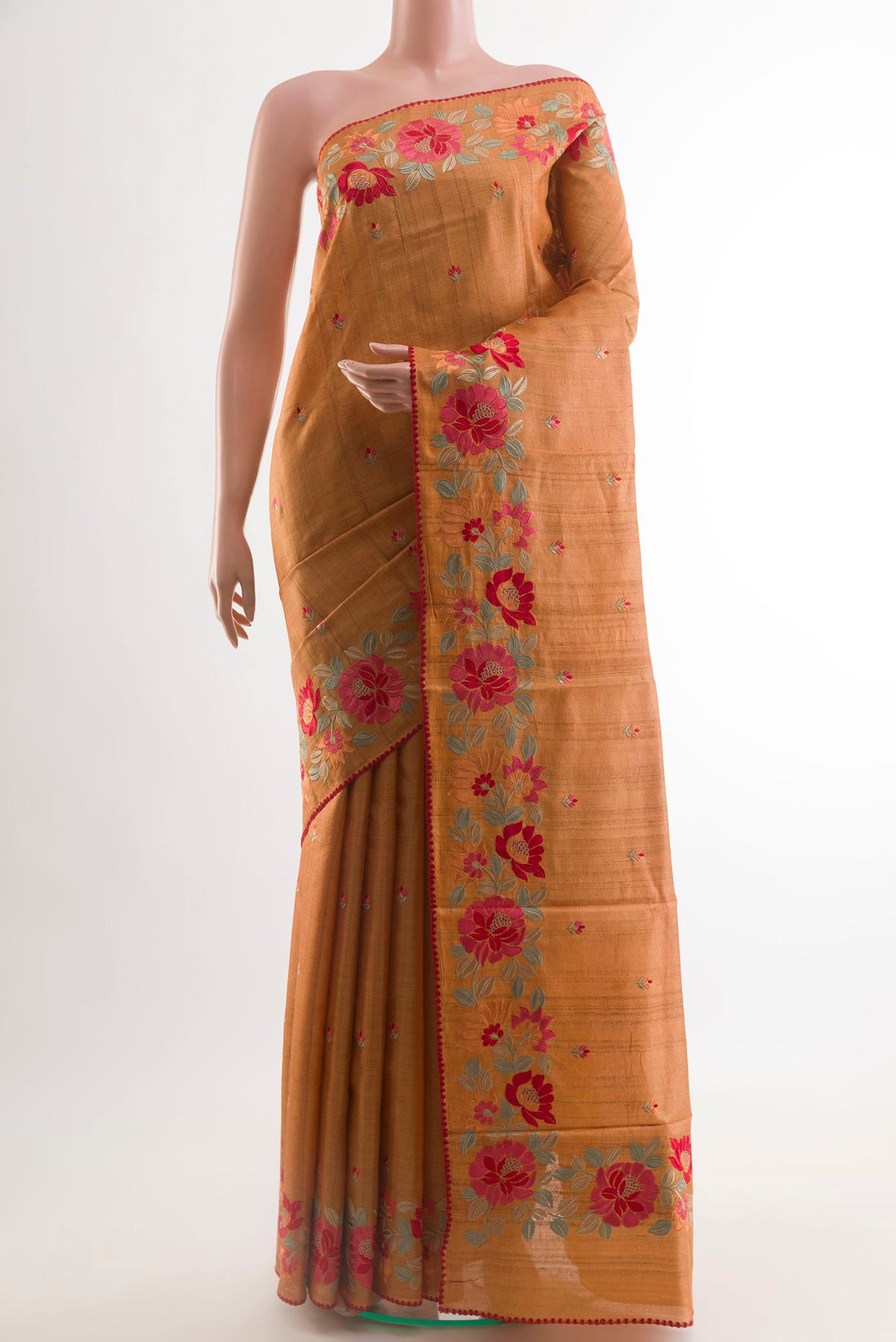 Mustard Tussar Saree with Thread Butta on the body and Embroidery Border.  displayed on a mannequin