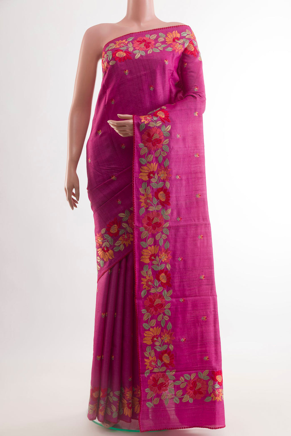 Pink Tussar Saree with Thread Butta on the body and Embroidery Border.  displayed on a mannequin