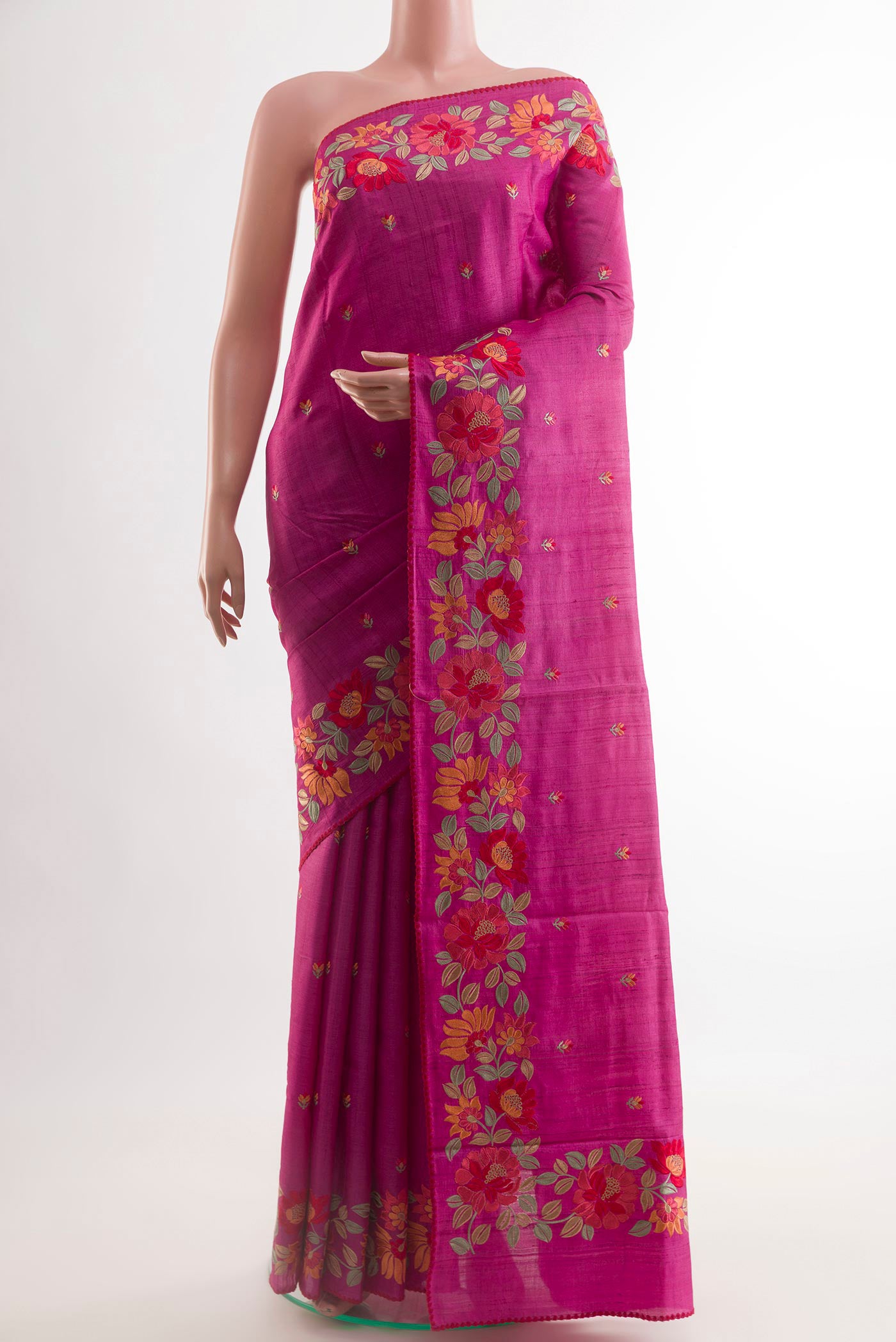 Pink Tussar Saree with Thread Butta on the body and Embroidery Border.  displayed on a mannequin