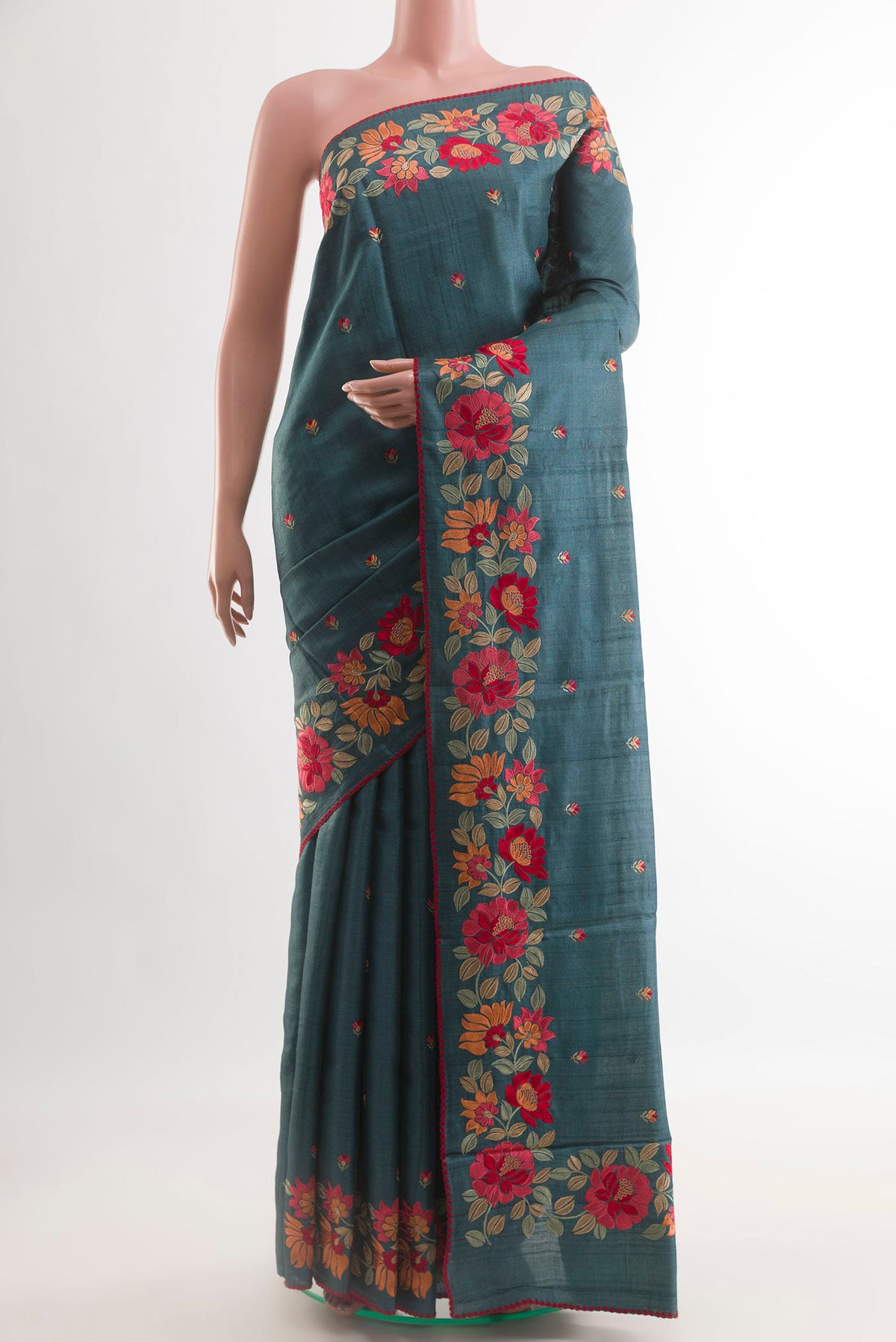 Blue Grey Tussar Saree with Thread Butta on the body and Embroidery Border.  displayed on a mannequin