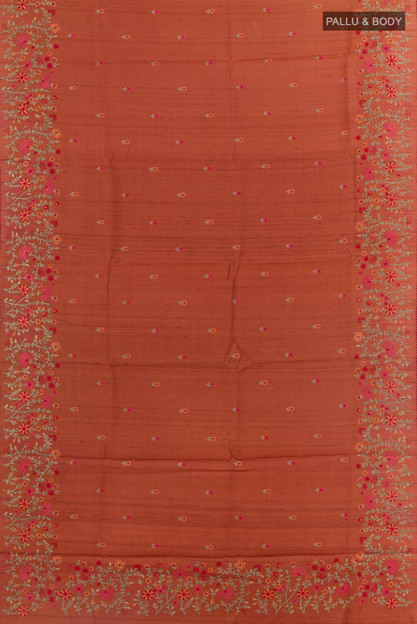 Flat view of Brick Orange Tussar Saree with Embroidery on the body and Embroidery Border. 
