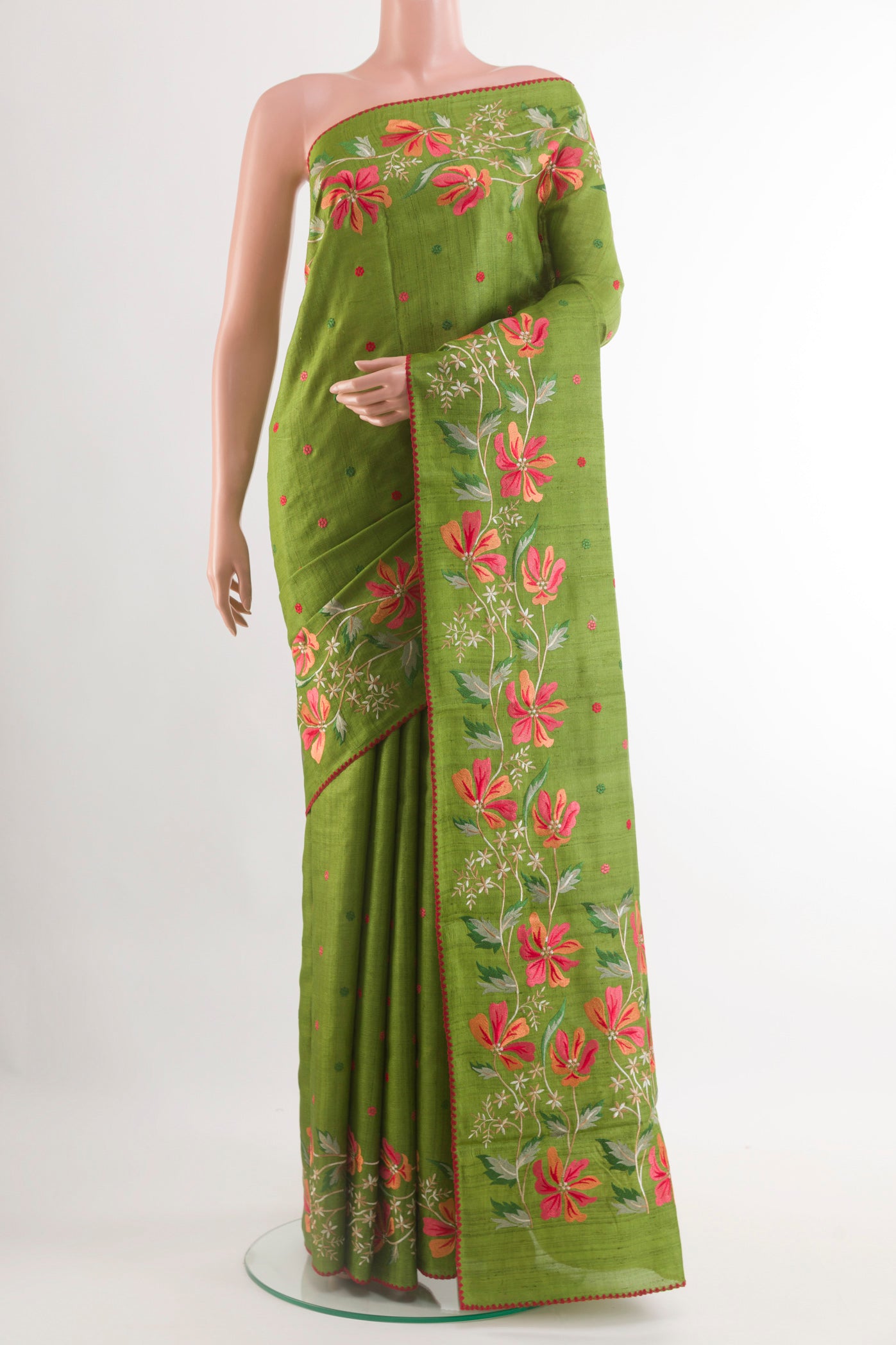 Green Tussar Saree with Thread Butta on the body and Zari Border.  displayed on a mannequin
