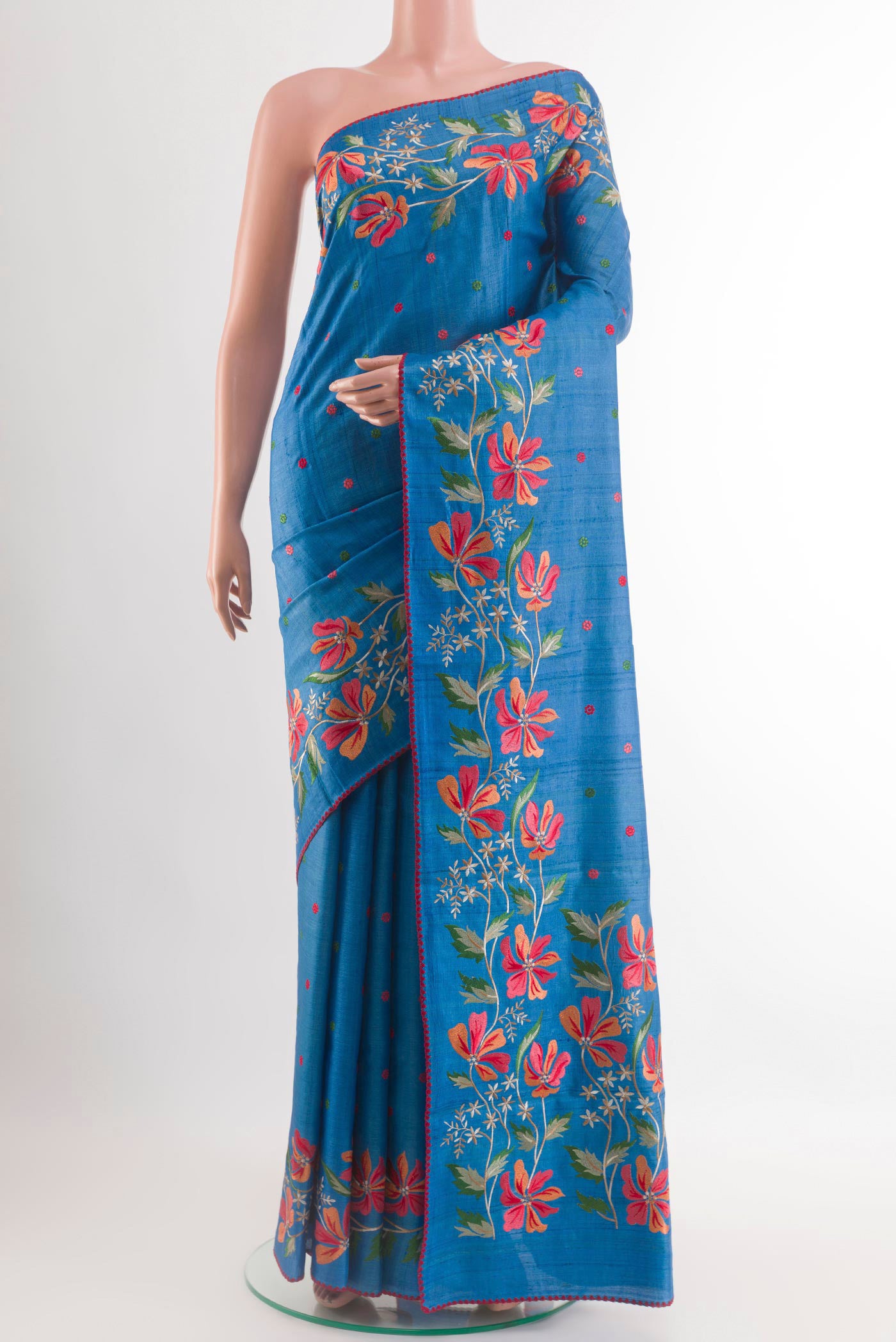 Blue Tussar Saree with Embroidery on the body and Embroidery Border.  displayed on a mannequin