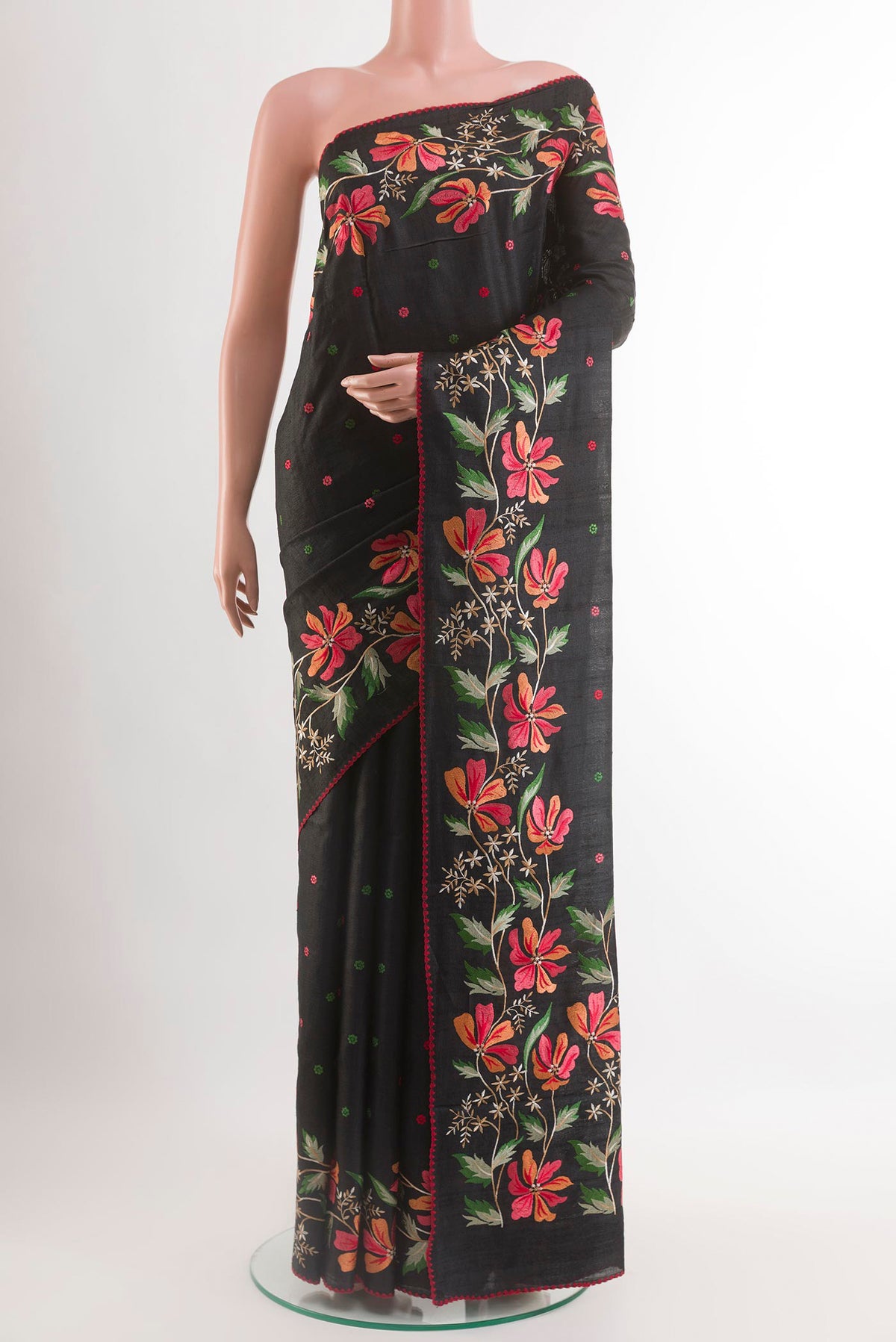 Black Tussar Saree with Embroidery on the body and Embroidery Border.  displayed on a mannequin
